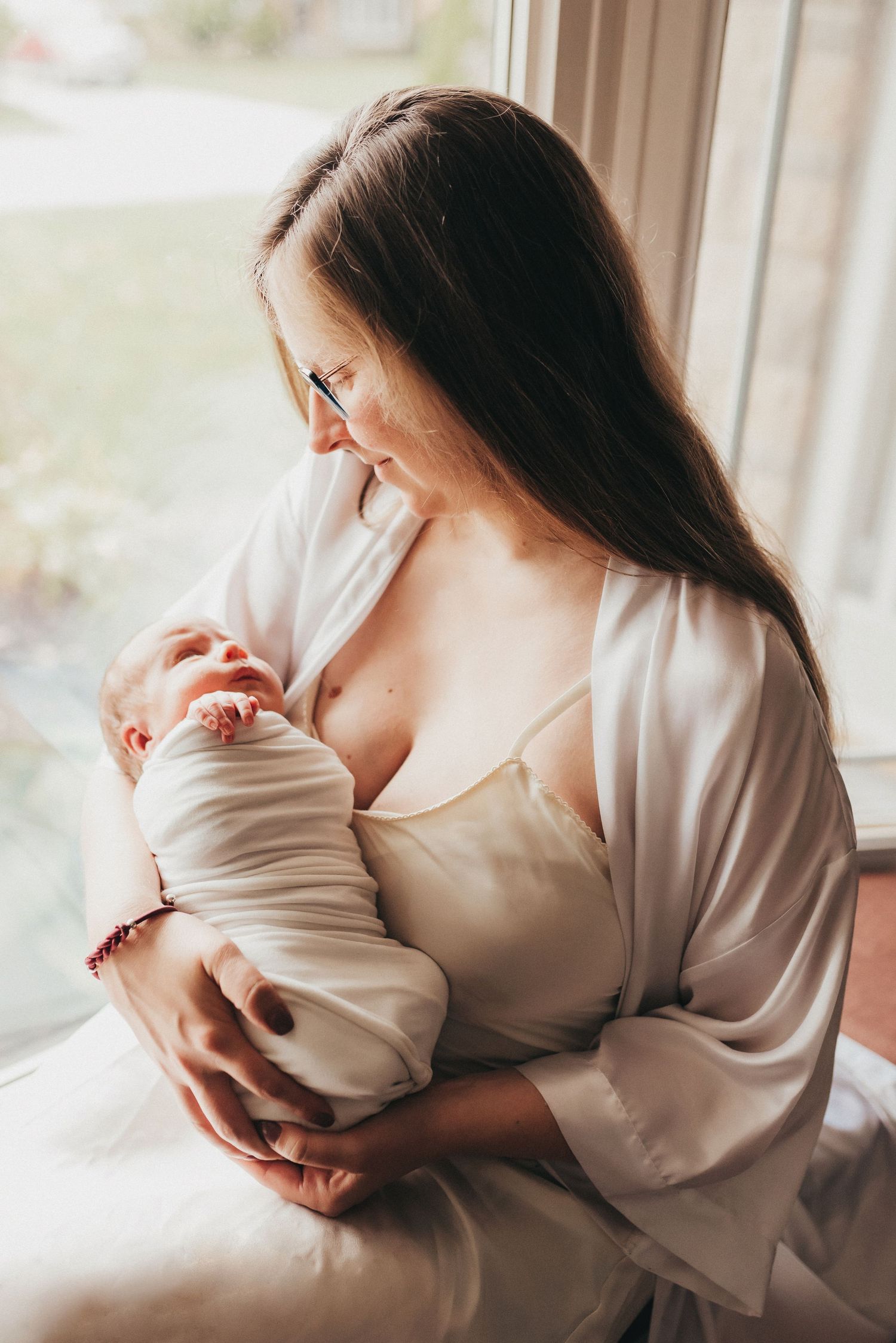 Motherhood newborn session portrait in home