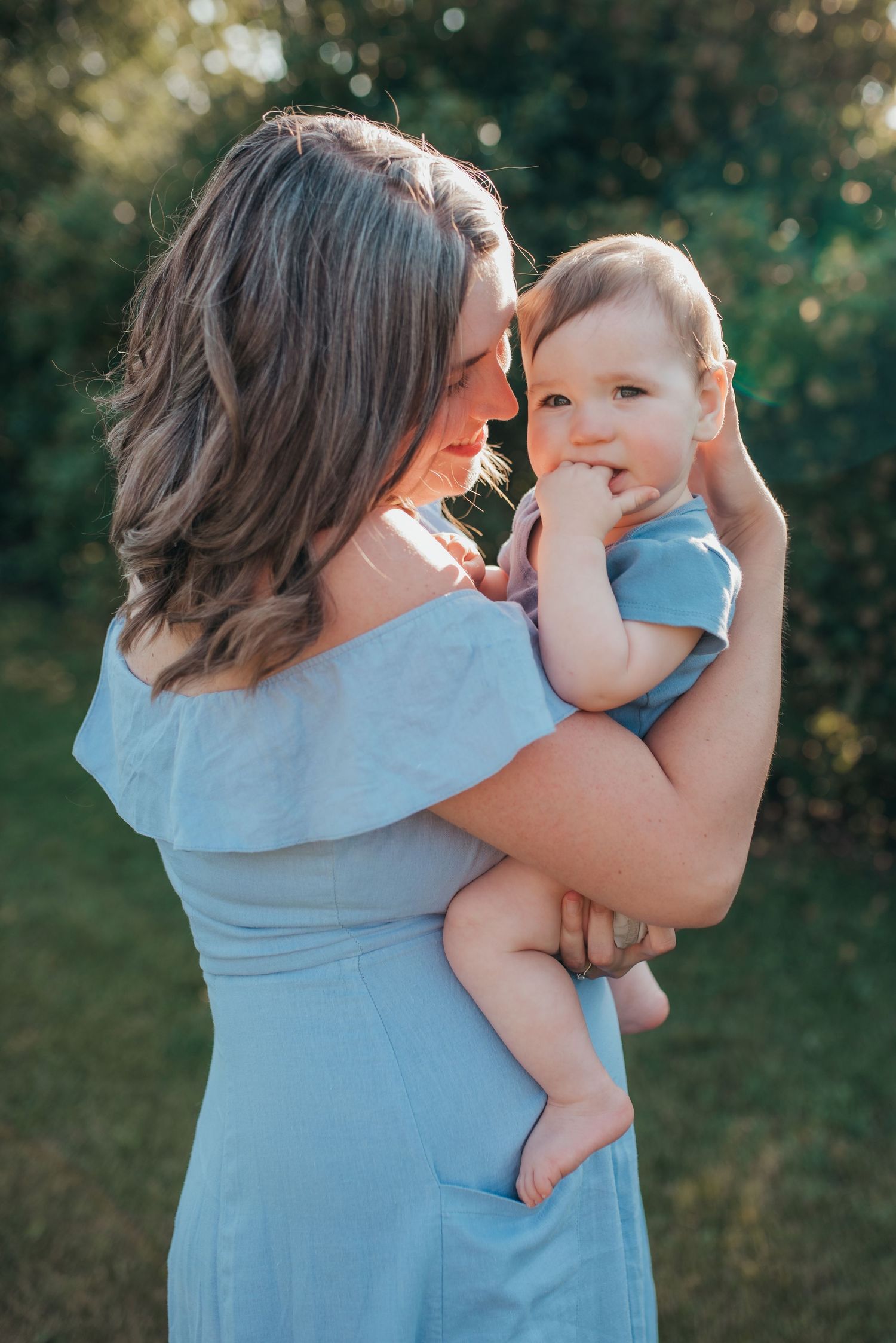 Motherhood mom and baby portrait outdoor golden hour