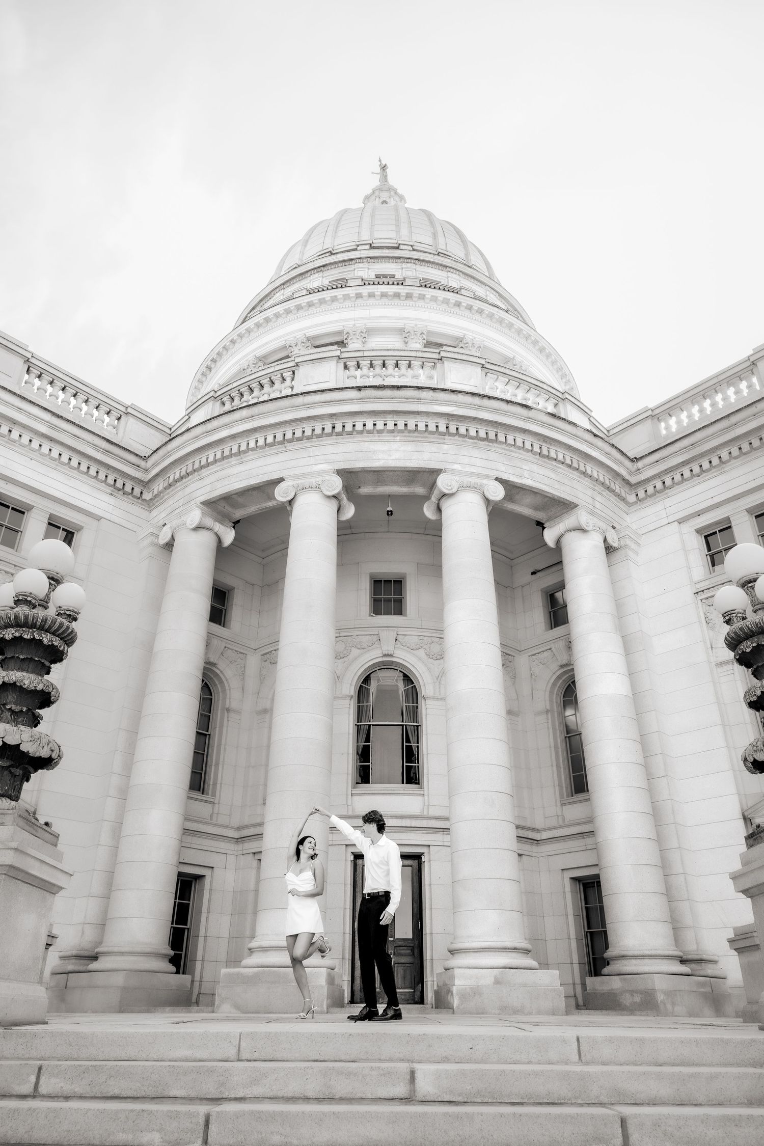 Black and white architectural engagement photos featuring dramatic columns and dome.