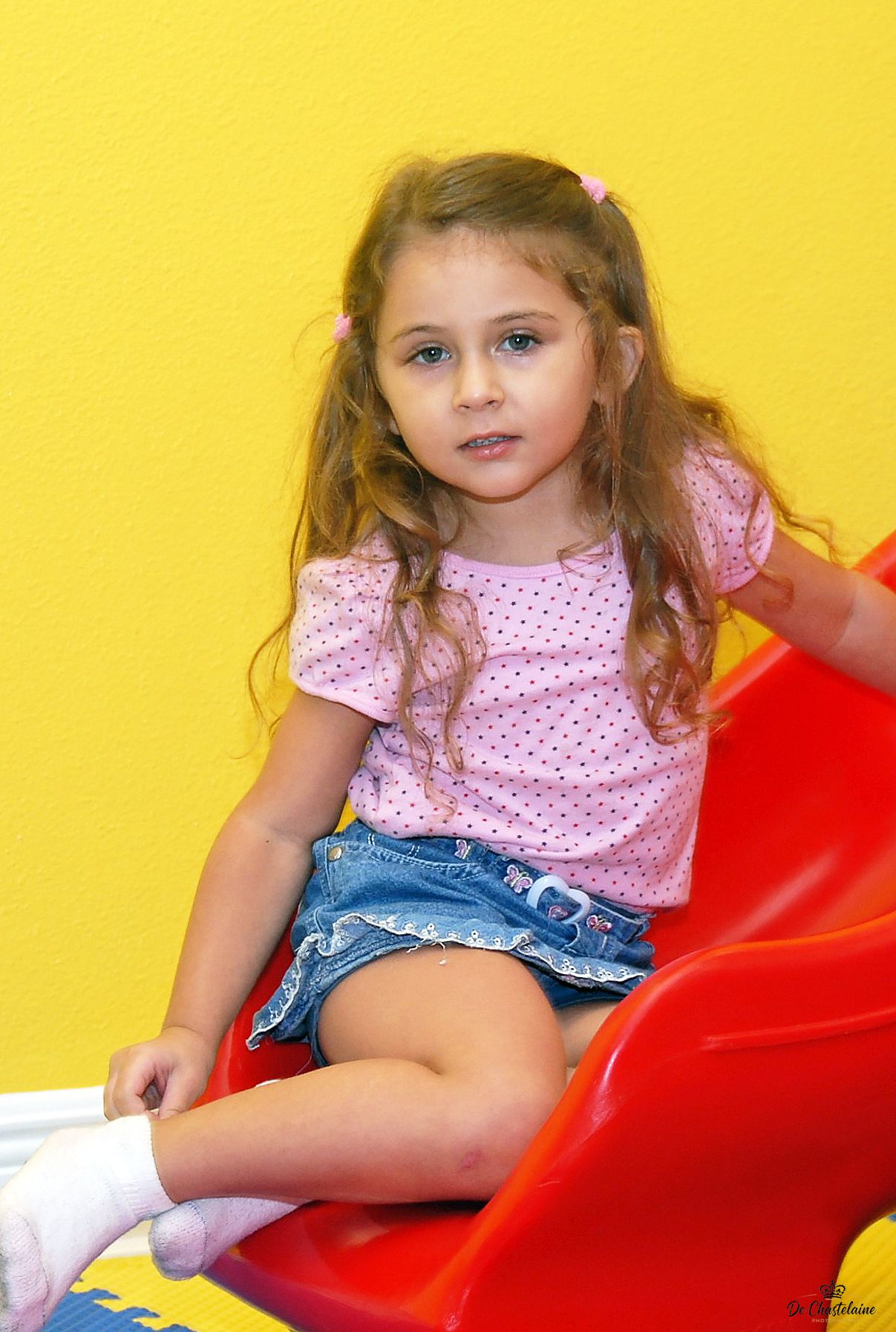 Child portrait girl on slide