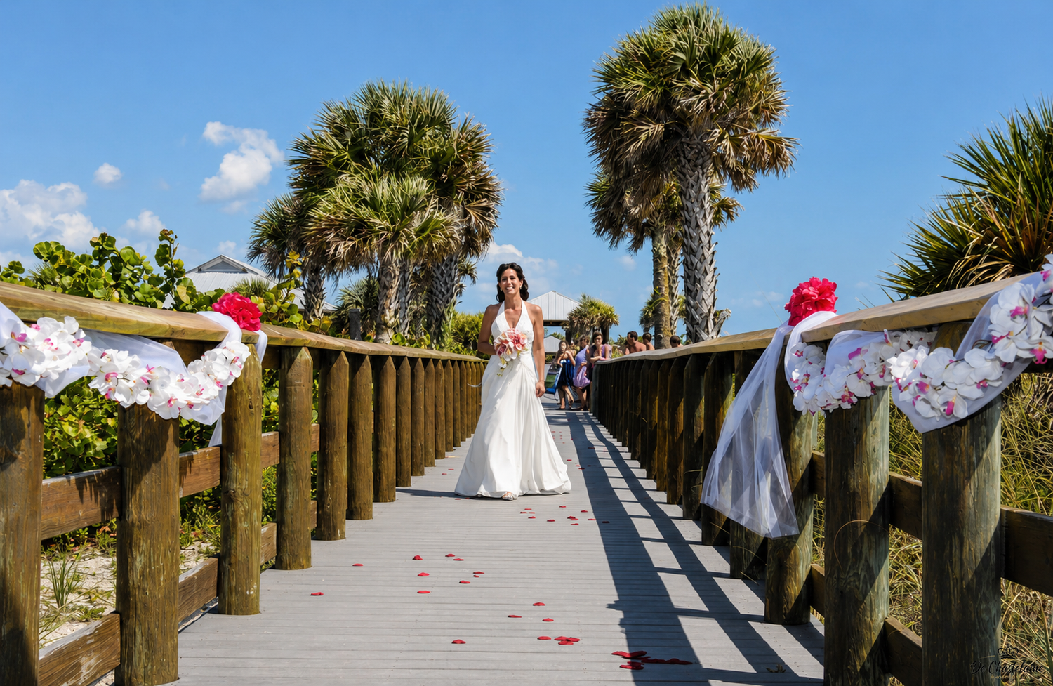 Bride at beach wedding with palms