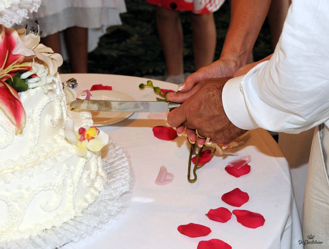 Cutting of a Wedding Cake by Bride and Groom