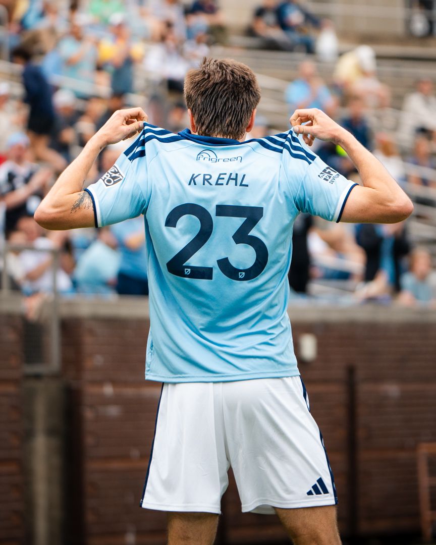 Chattanooga FC Soccer player shows jersey number 23 with name KREHL to the crowd after scoring a goal.