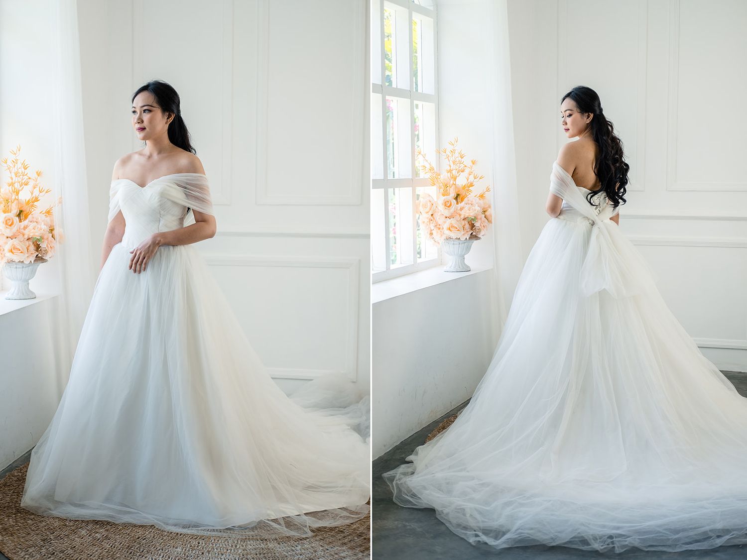 Elegant off-shoulder white tulle A-line wedding dress with a long train, modeled in a bright studio setting.