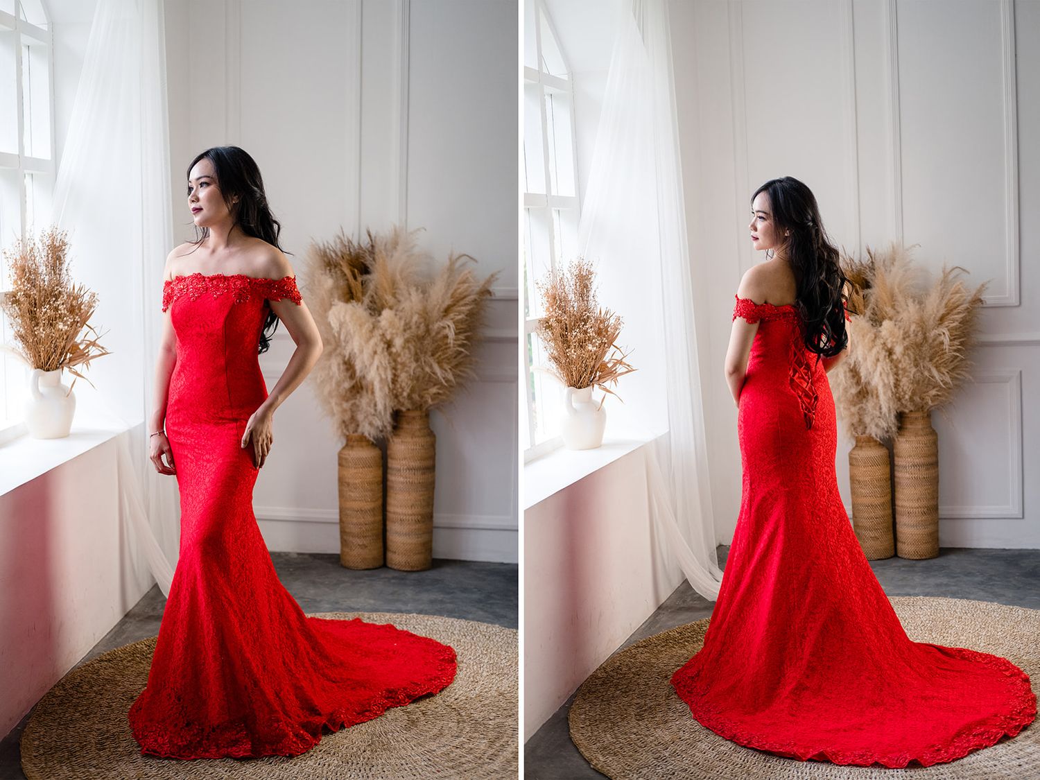 Woman in a red off-shoulder mermaid lace gown with train posing in a bright studio.