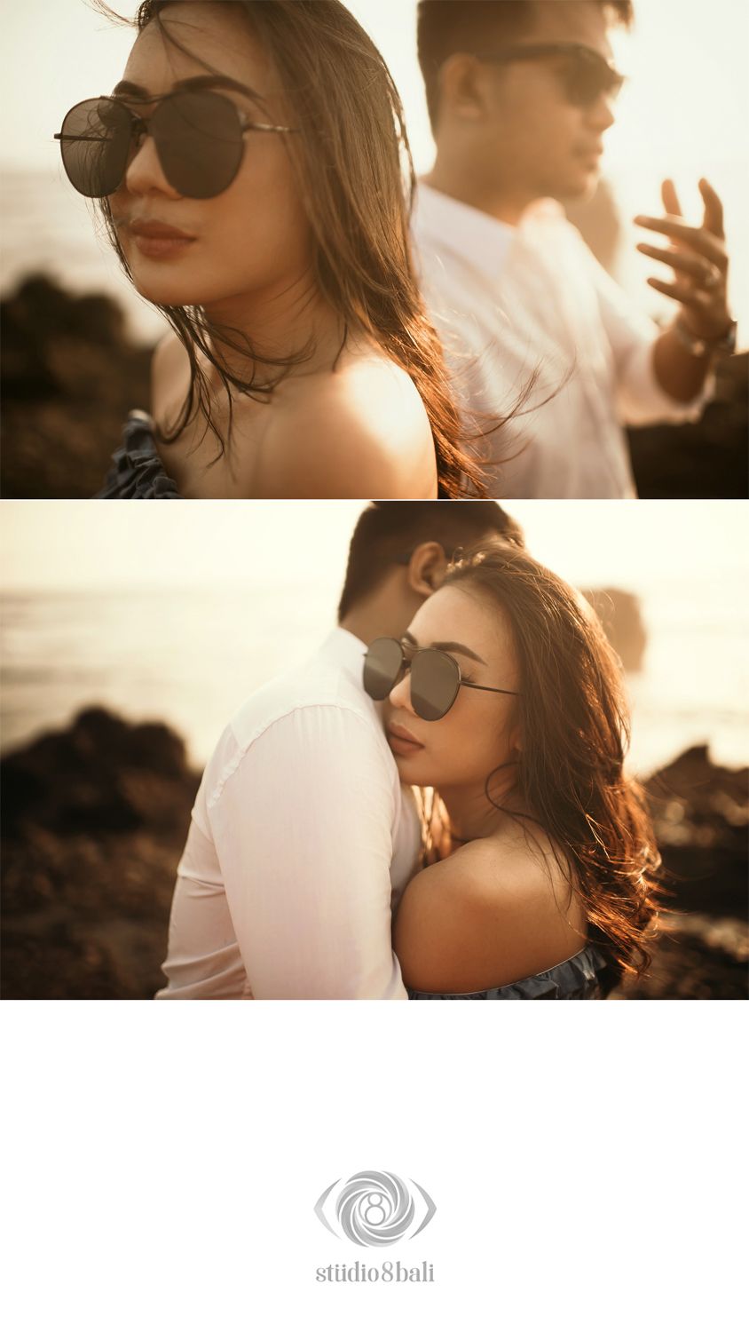Couple poses romantically at golden hour on rocky Bali coast, woman in sunglasses leans back against man in white shirt.