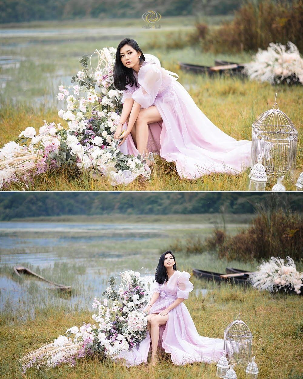 Woman in pink gown poses by floral arrangement near lake in outdoor photoshoot.