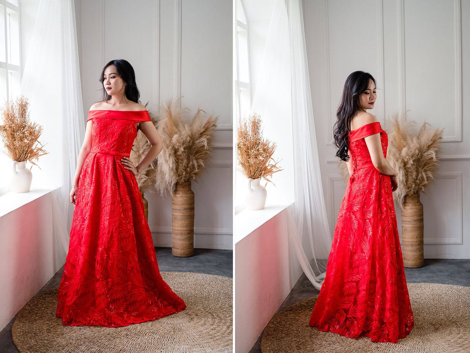 Woman wearing a red off-shoulder lace A-line gown posing gracefully in a bright studio.