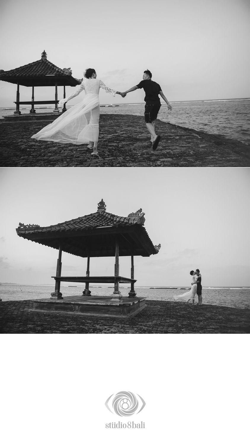 Black and white beach wedding photos with couple holding hands near Balinese pavilion by the ocean in Bali.