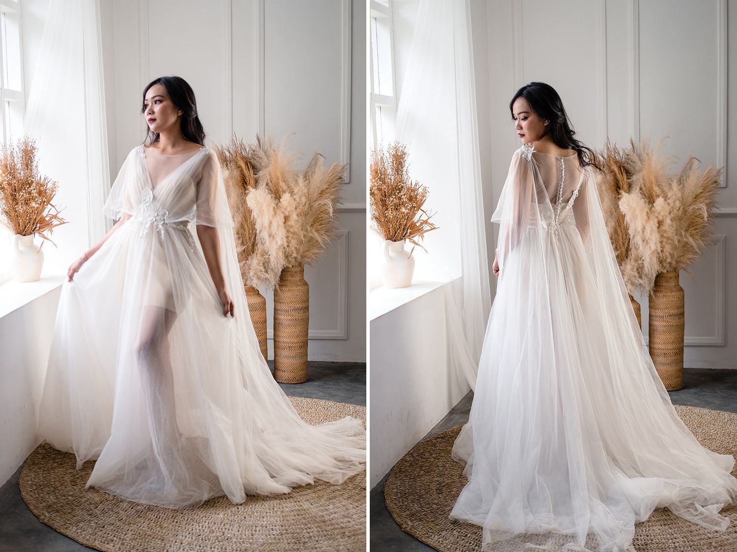 Bride in sheer white tulle wedding gown with flutter sleeves poses near window with pampas grass decor.