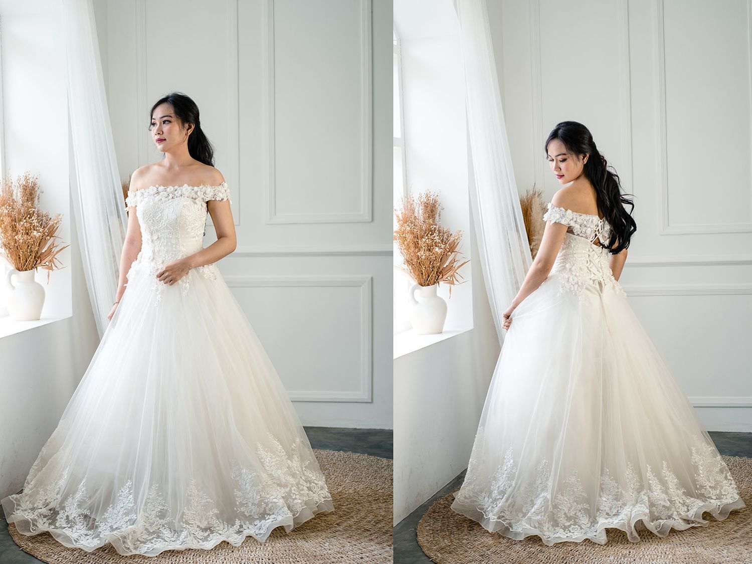 Elegant bride in a white off-shoulder ball gown with lace details, posing gracefully in a bright, minimalist studio.