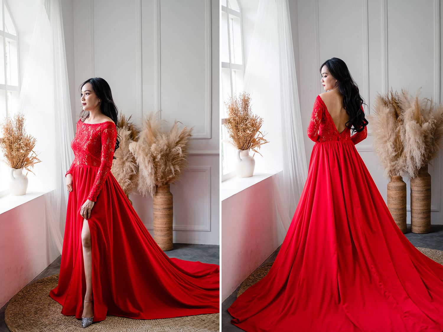 Woman in elegant red off-shoulder gown with long sleeves and high slit, posing gracefully by a window.