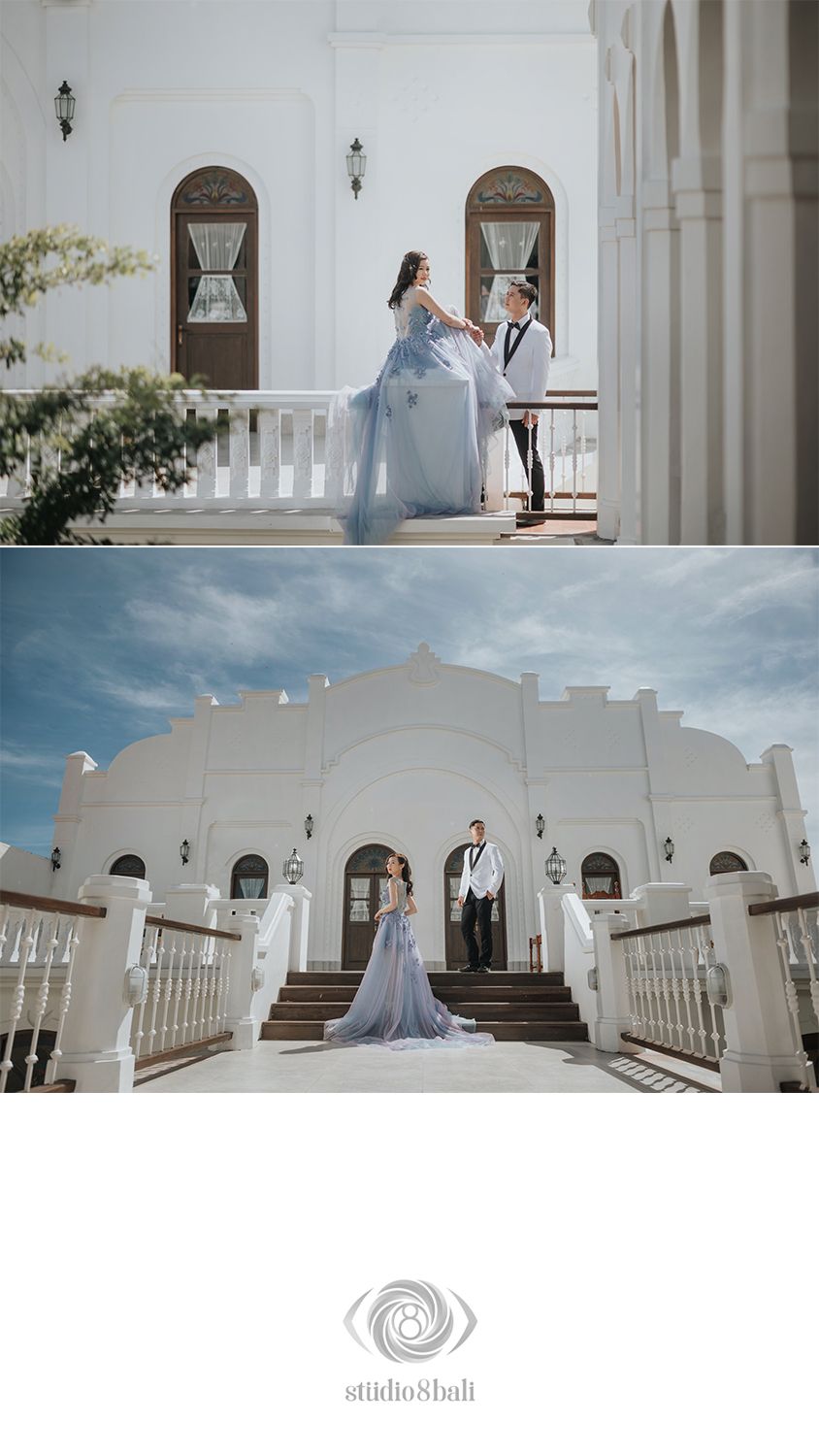 Couple in blue gown and suit posing on white balcony and grand staircase of elegant venue for wedding photos.