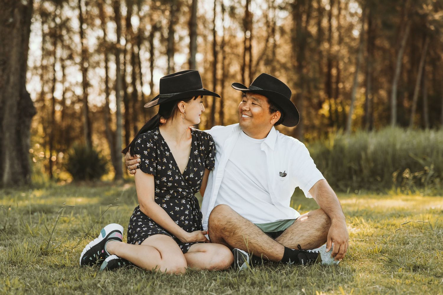 Couple sitting together in golden light outdoors, Sydney outdoor portrait photography