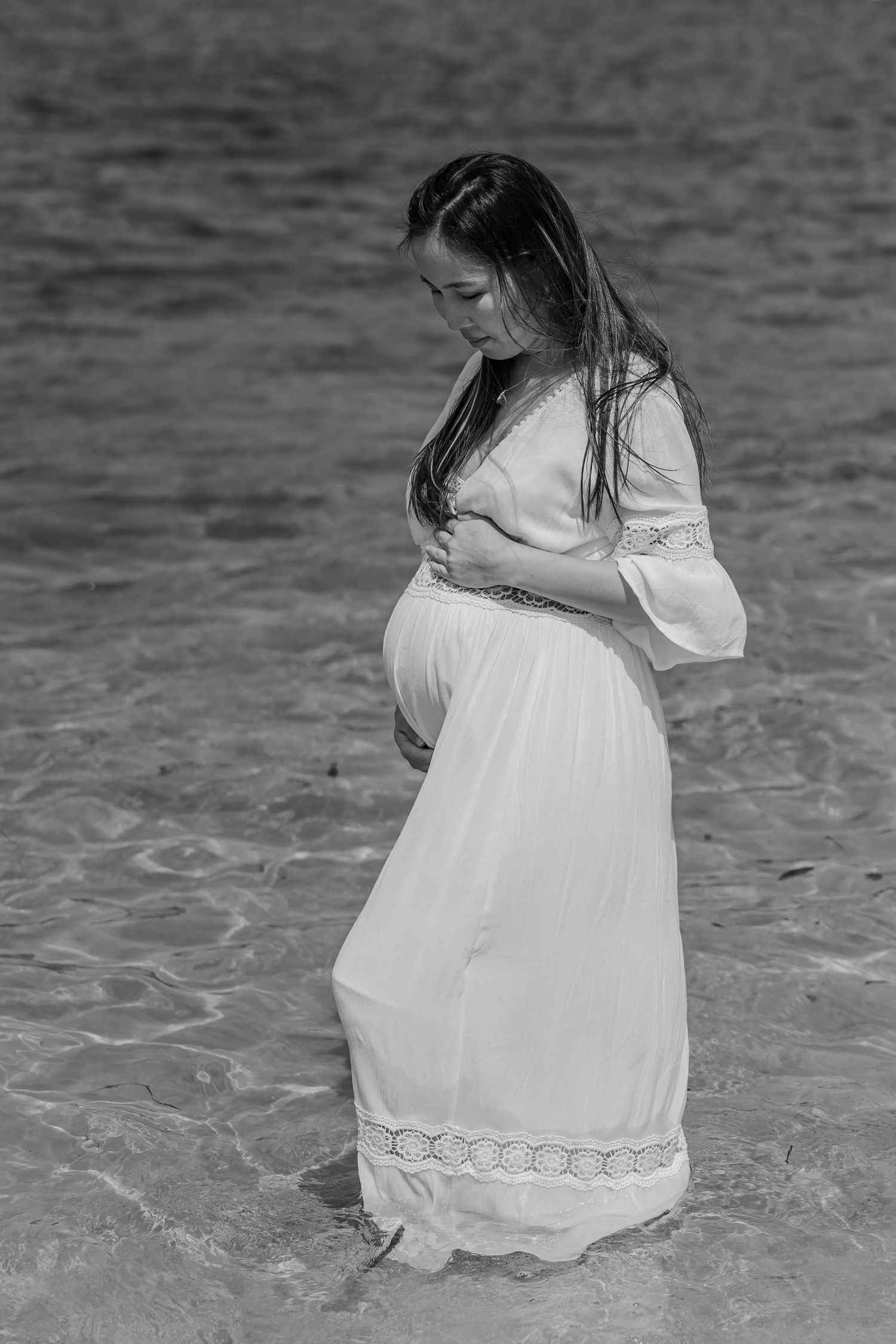 Black and white maternity portrait of pregnant woman standing outdoors, Sydney maternity photography