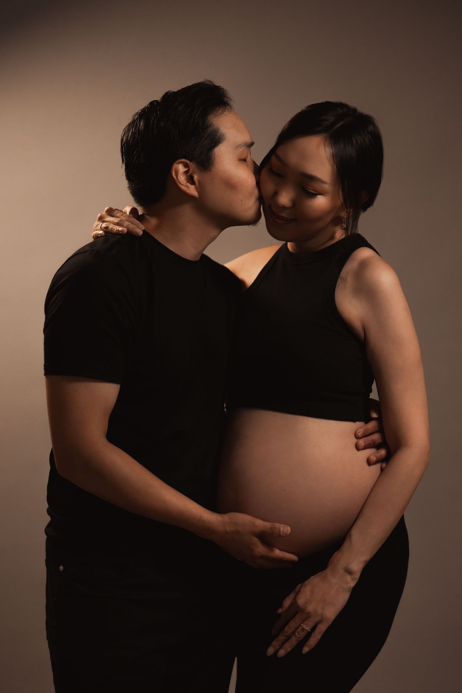 Studio maternity couple portrait with warm tones, Sydney maternity photographer