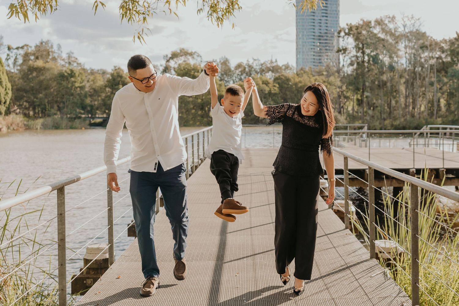 Family walking on bridge outdoors in natural light, Sydney family photographer