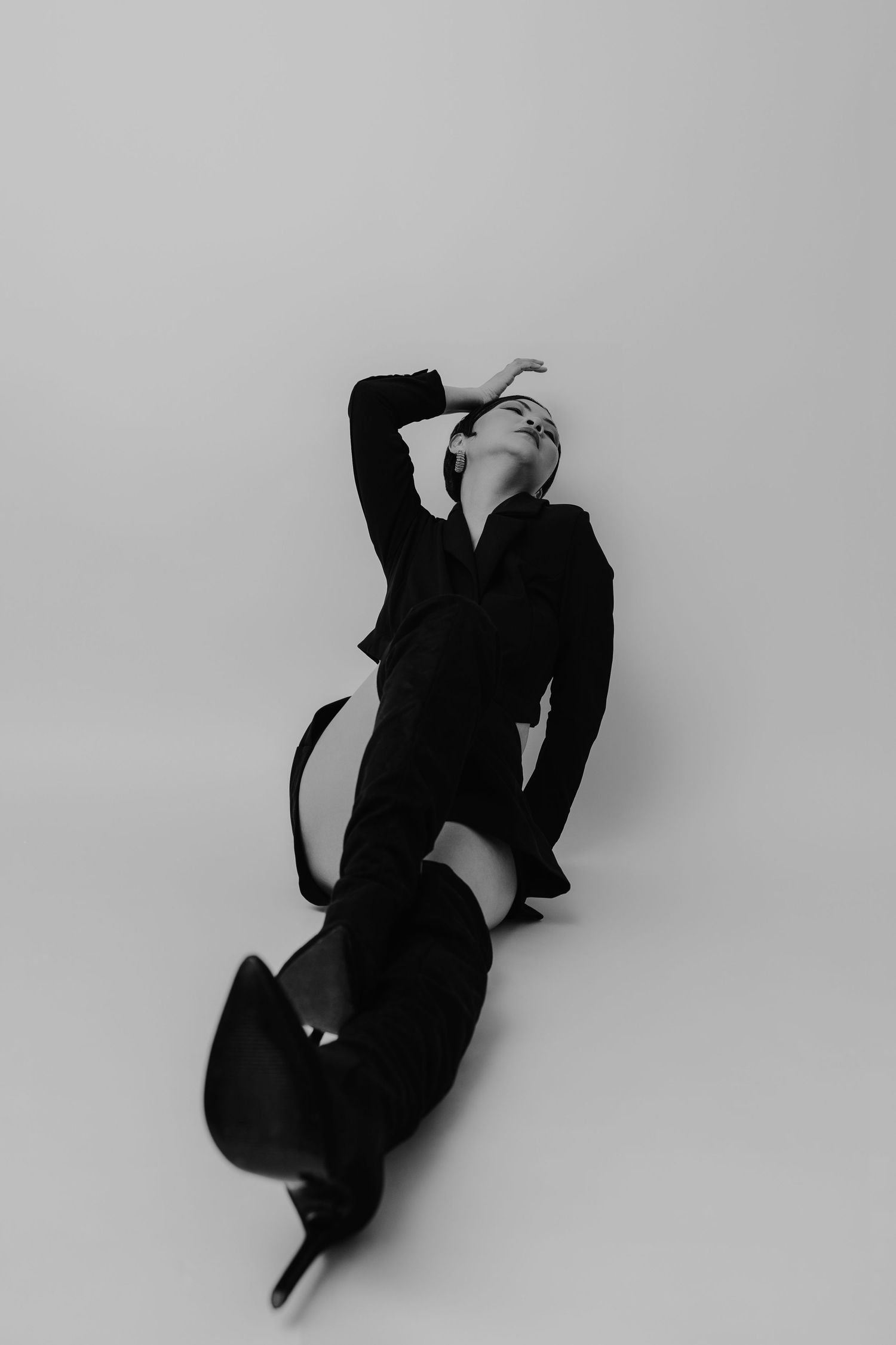 Black and white studio portrait of a woman posing in a minimalist style, Sydney