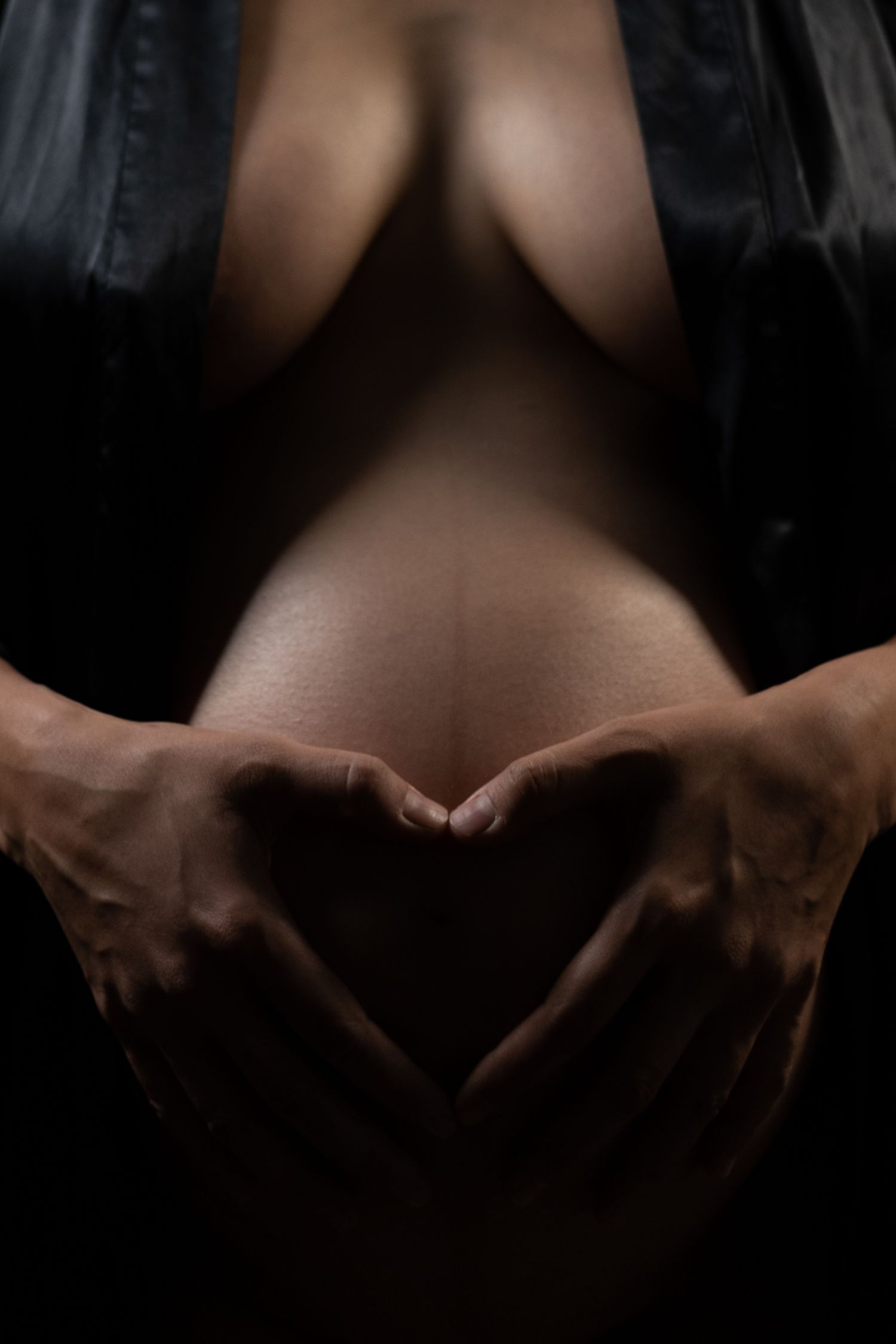 Artistic maternity belly close up with hands forming heart, Sydney maternity photographer