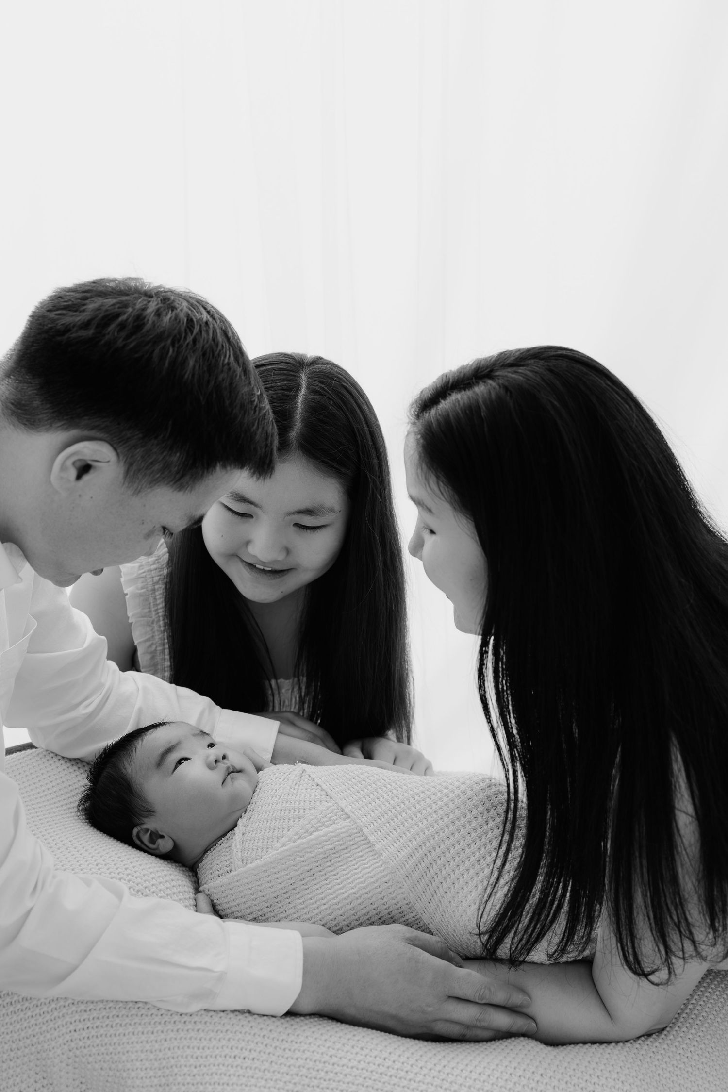 Black and white newborn lifestyle portrait of mother holding baby, Sydney newborn photography