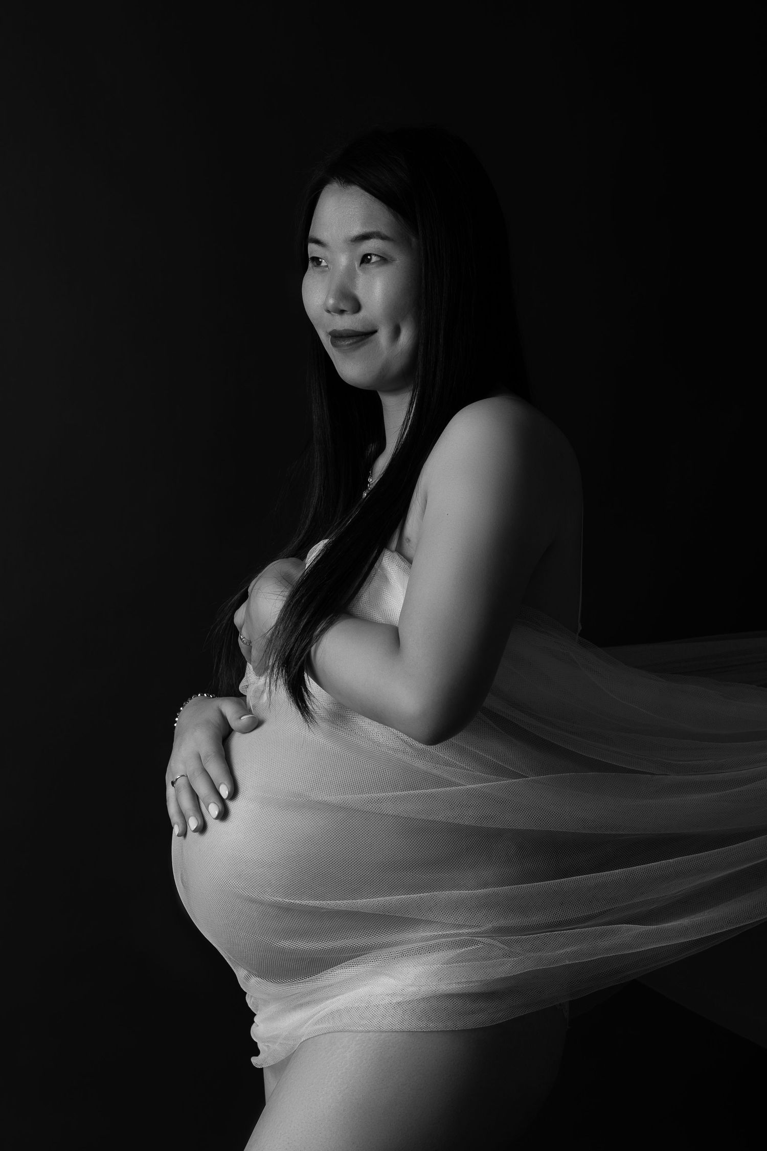 Black and white maternity portrait in studio, Sydney maternity photographer