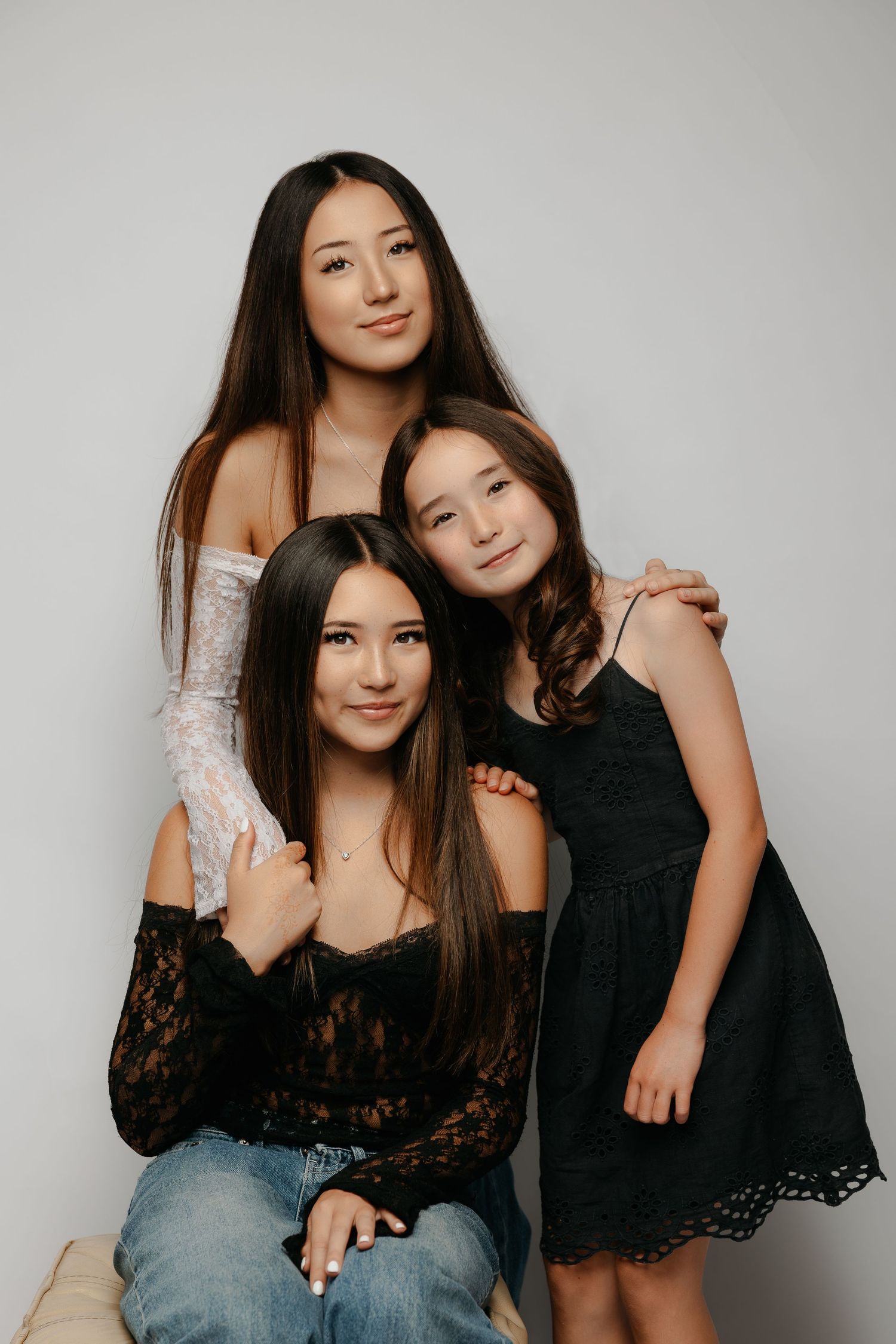 Studio portrait of three women hugging, photographed in Sydney studio