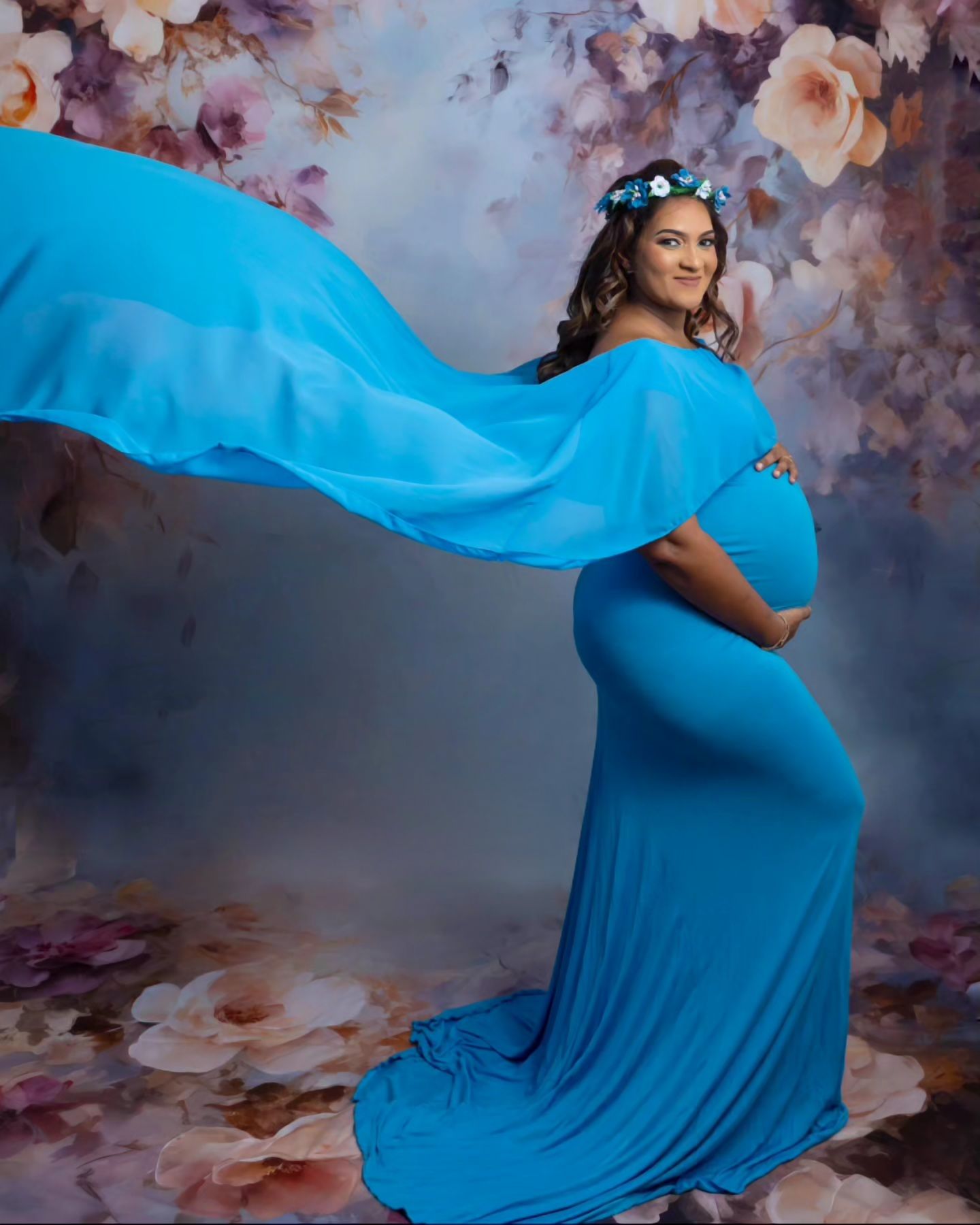 pregnant boy mom in blue with tossed train