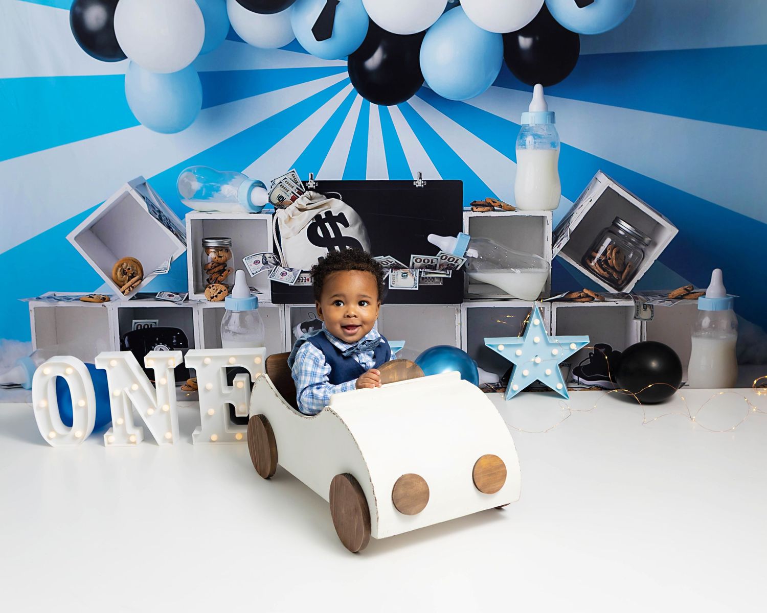 Boss baby themed, baby boy smiling driving a buggy car