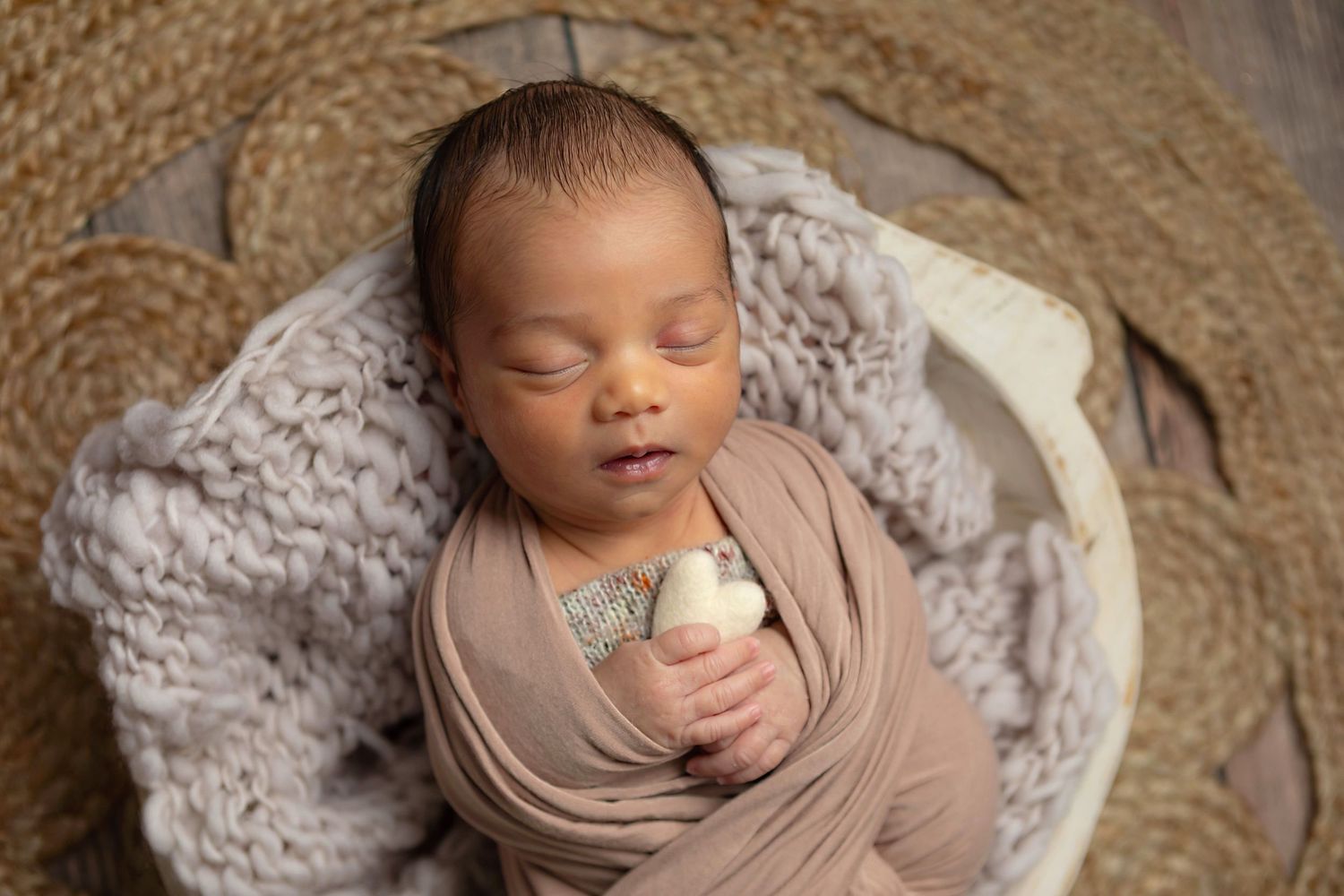 baby boy posed in neutral colors