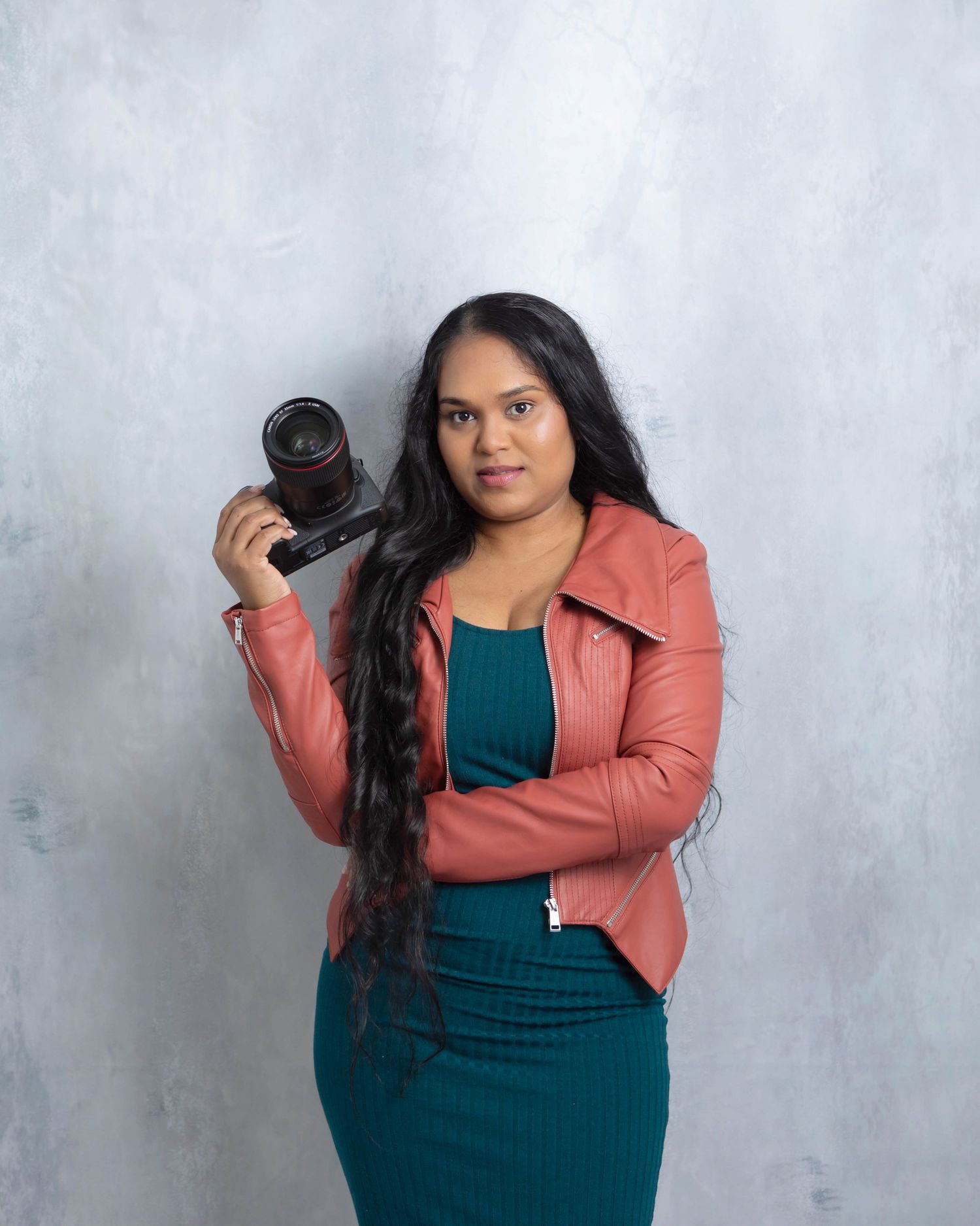 Photographer posing with camera in hand