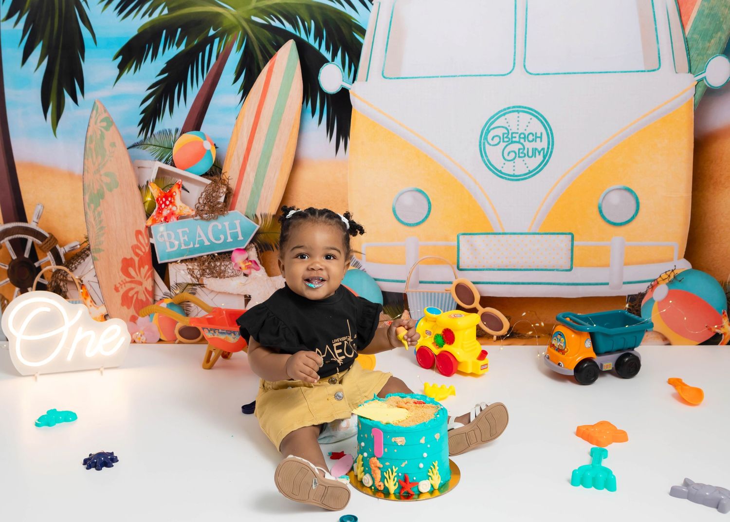 Beach themed first birthday with a baby girl and her cake