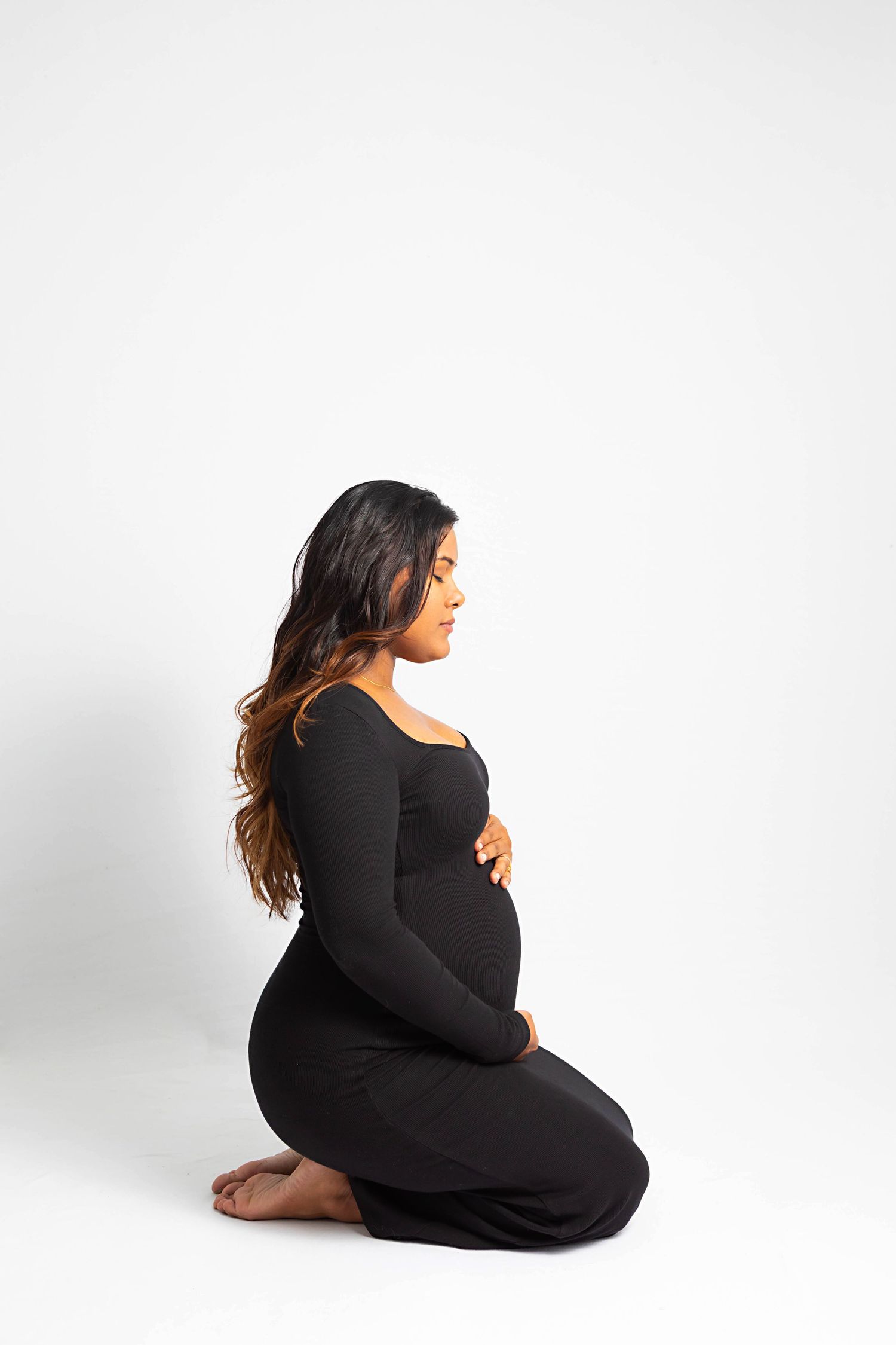 Pregnant mom in backlit photo