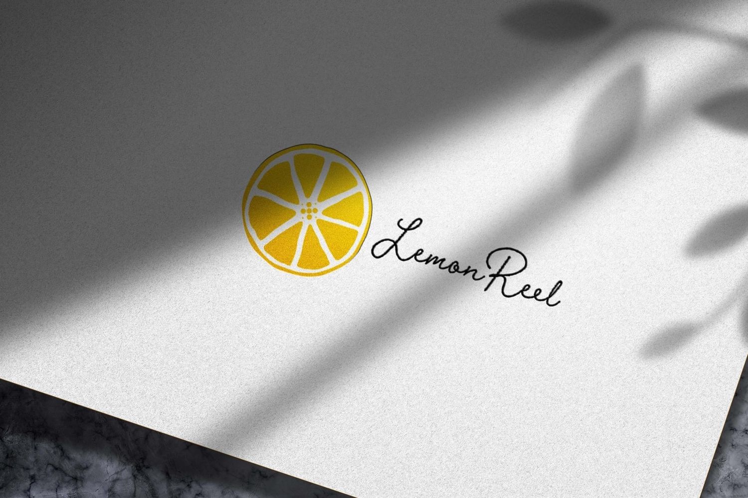 A series of minimalist black and white business cards with lemon logo designs and elegant typography.