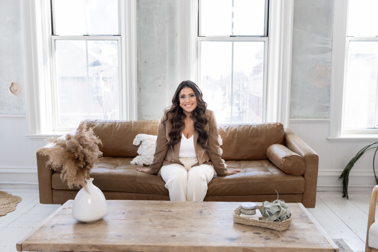 Casual lifestyle photos on wooden bench with leather sofa in background.