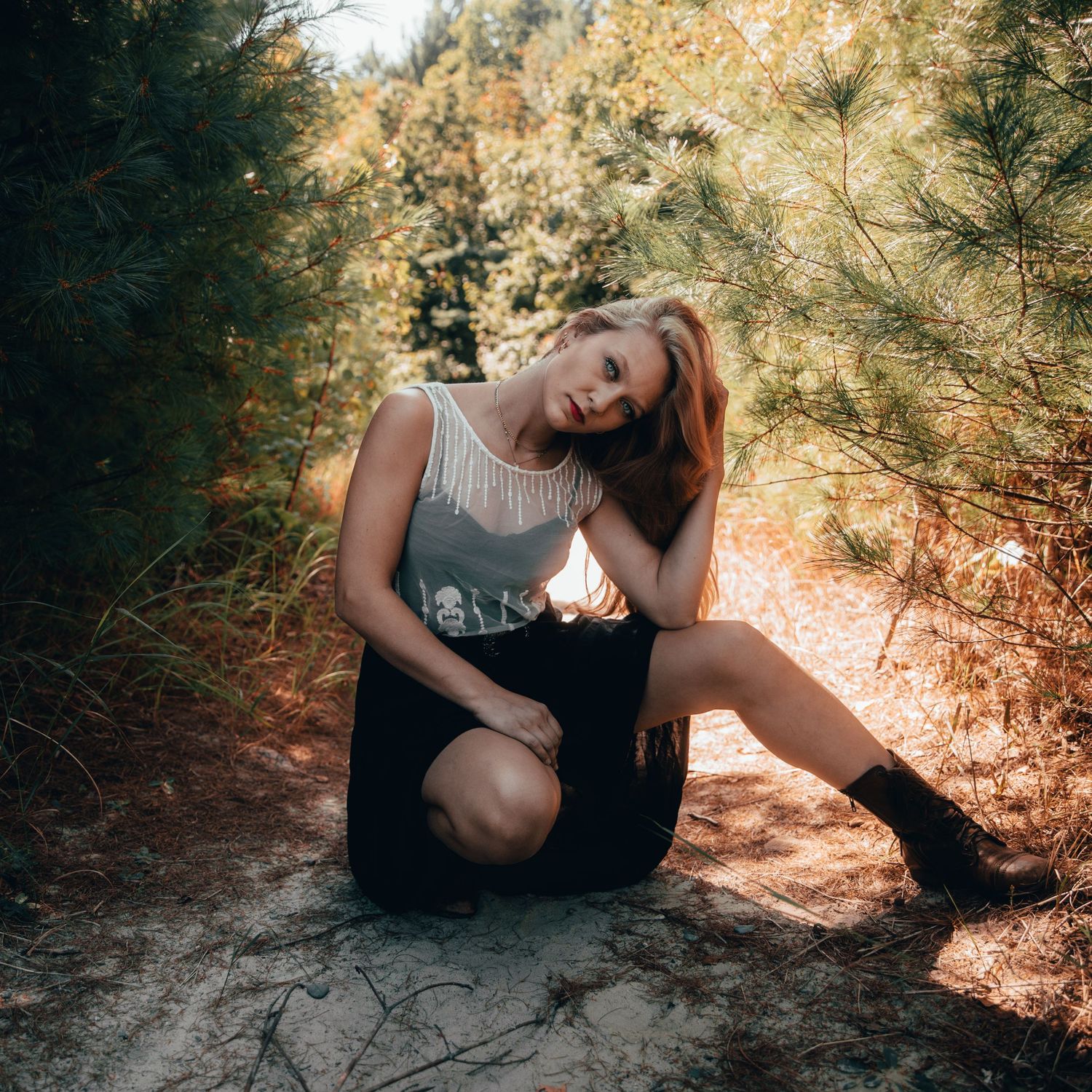 Artistic photo sequence showing poses on a sandy forest floor in dappled sunlight.