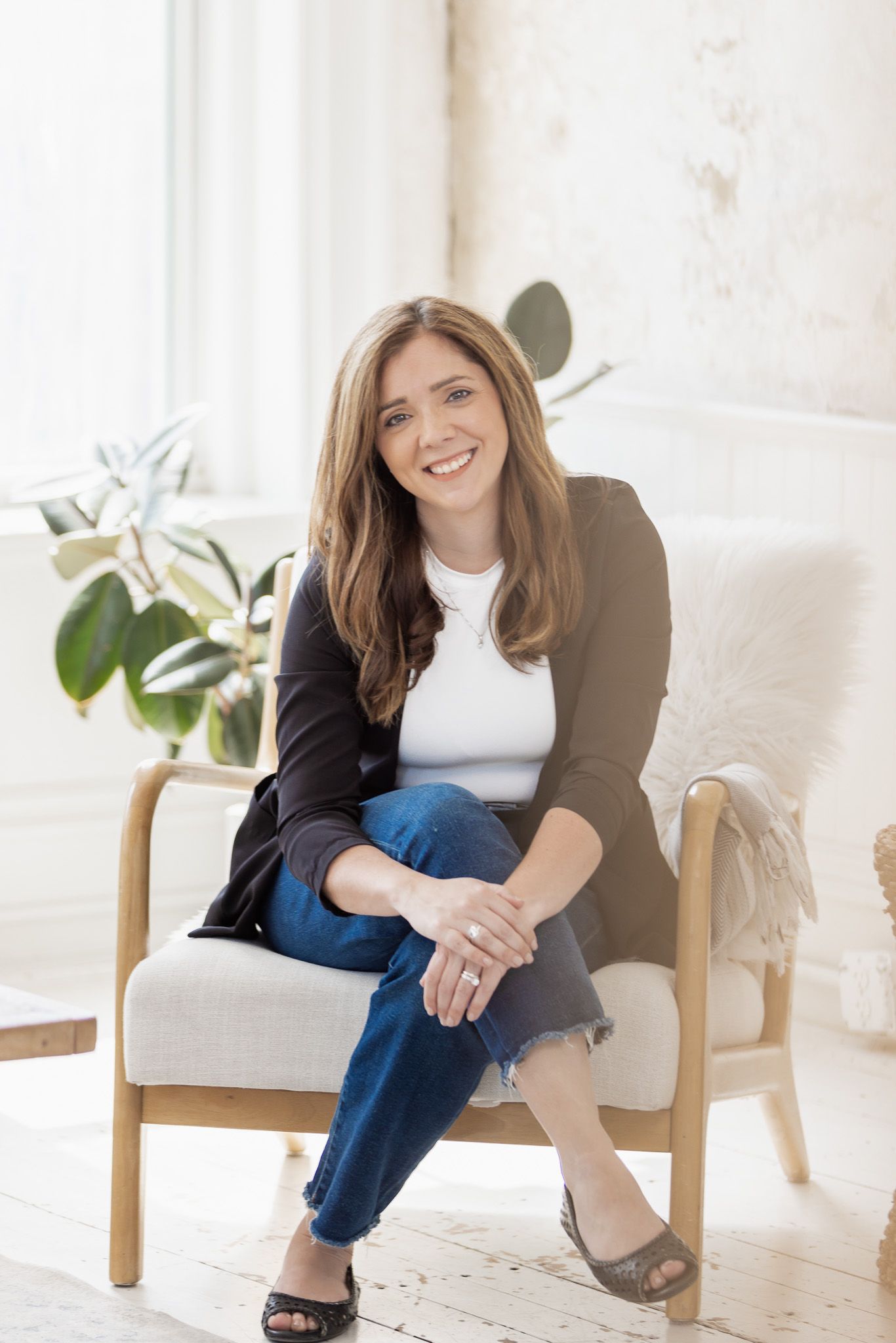 Casual lifestyle portraits in bright modern room with minimalist furniture.