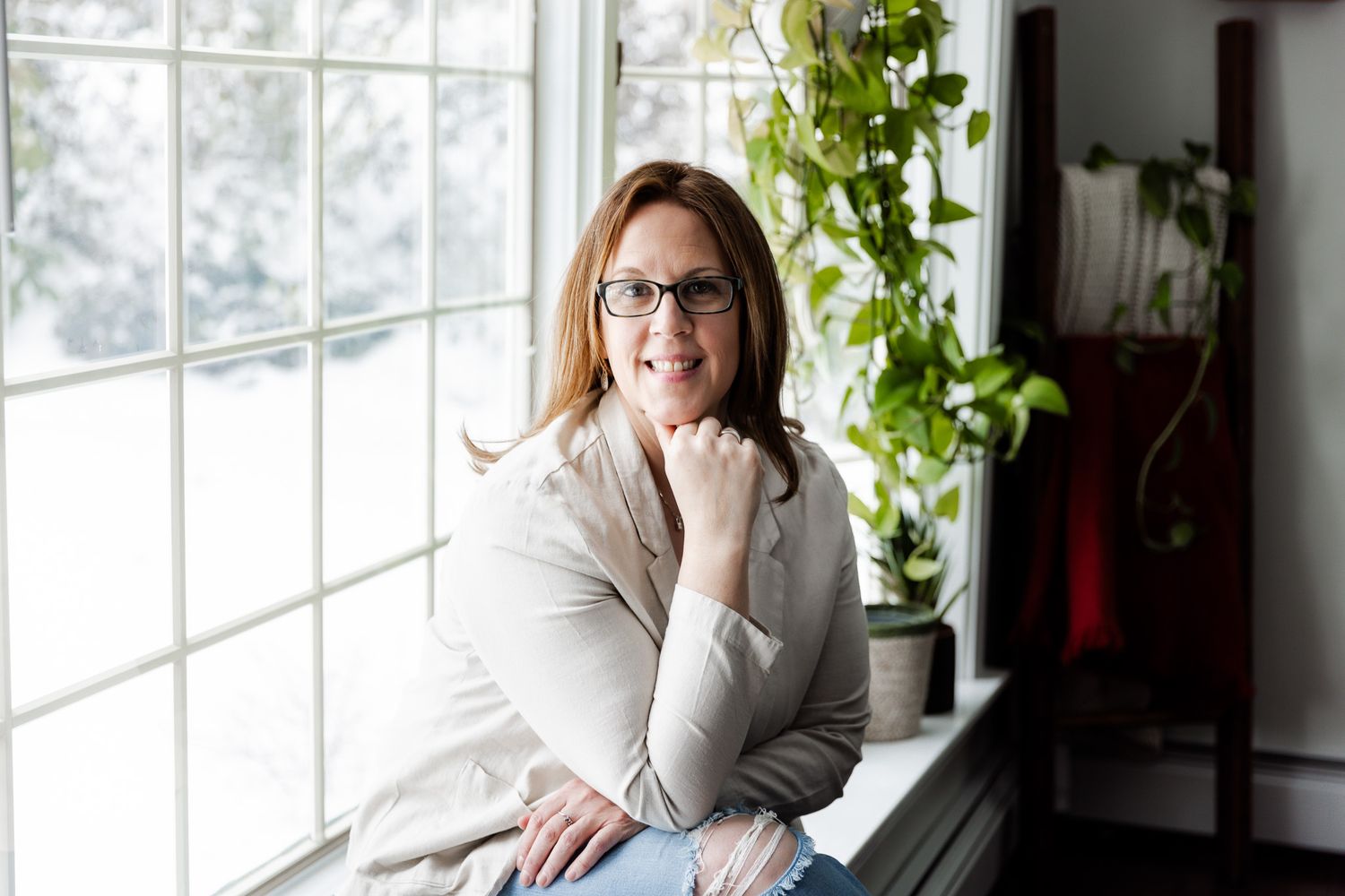Bright interior photography session near large windows with natural lighting.