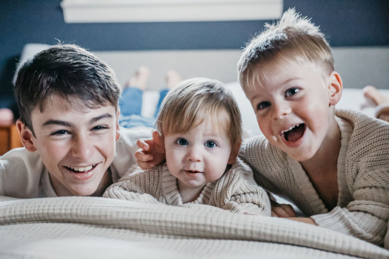 A series of candid family photos showing joyful expressions and laughter.