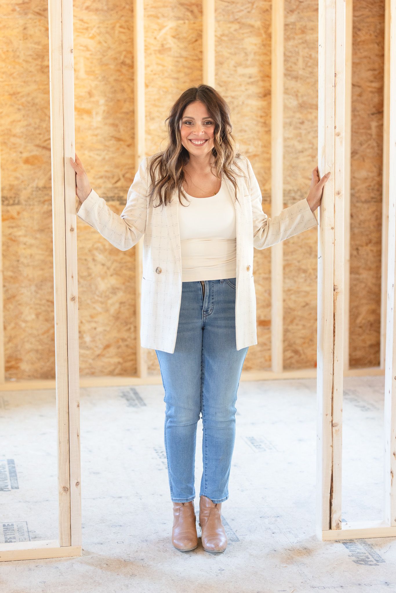 Construction or renovation progress photos showing wooden framing in an unfinished space.