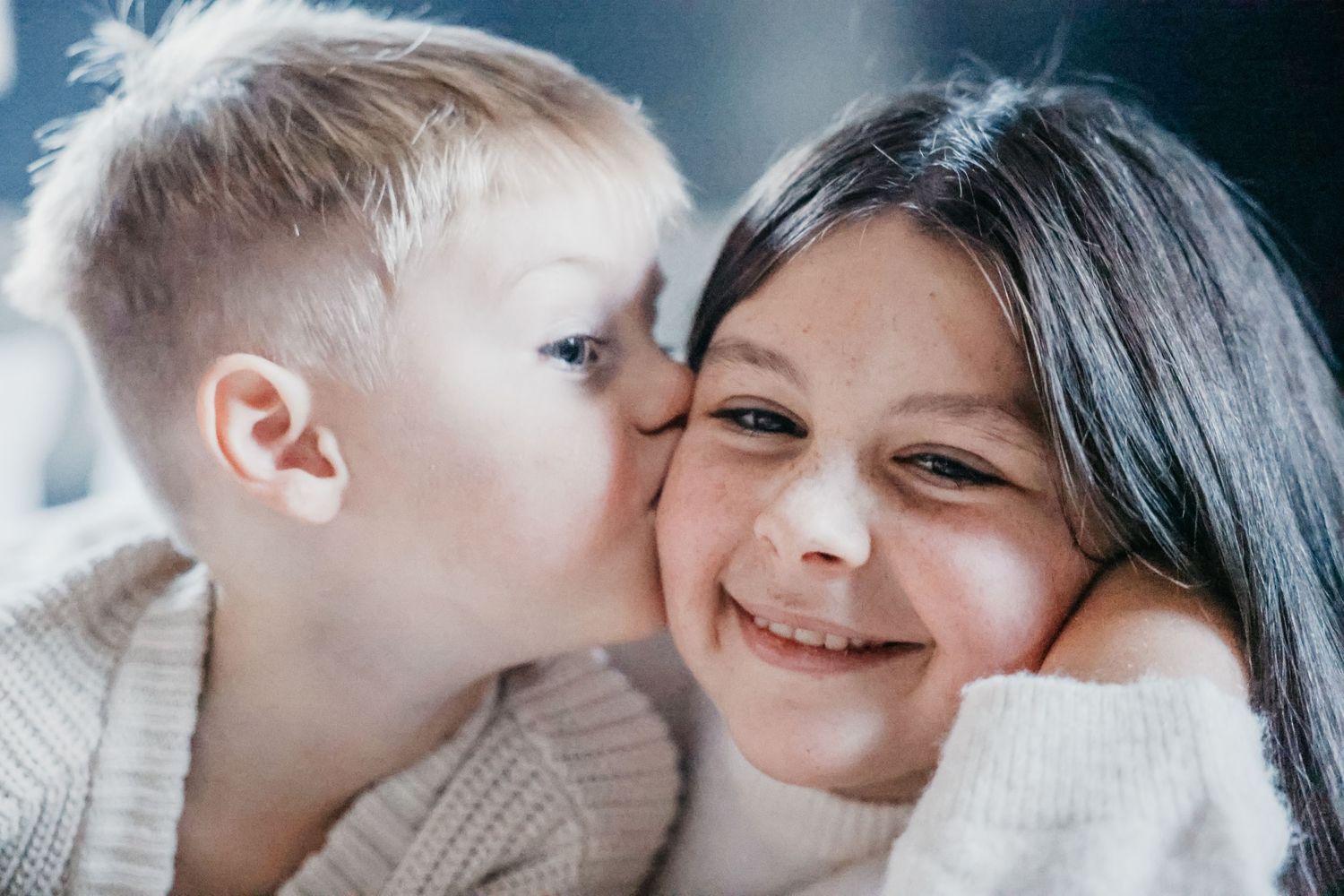 Close up intimate portrait showing warm affection and smiles.