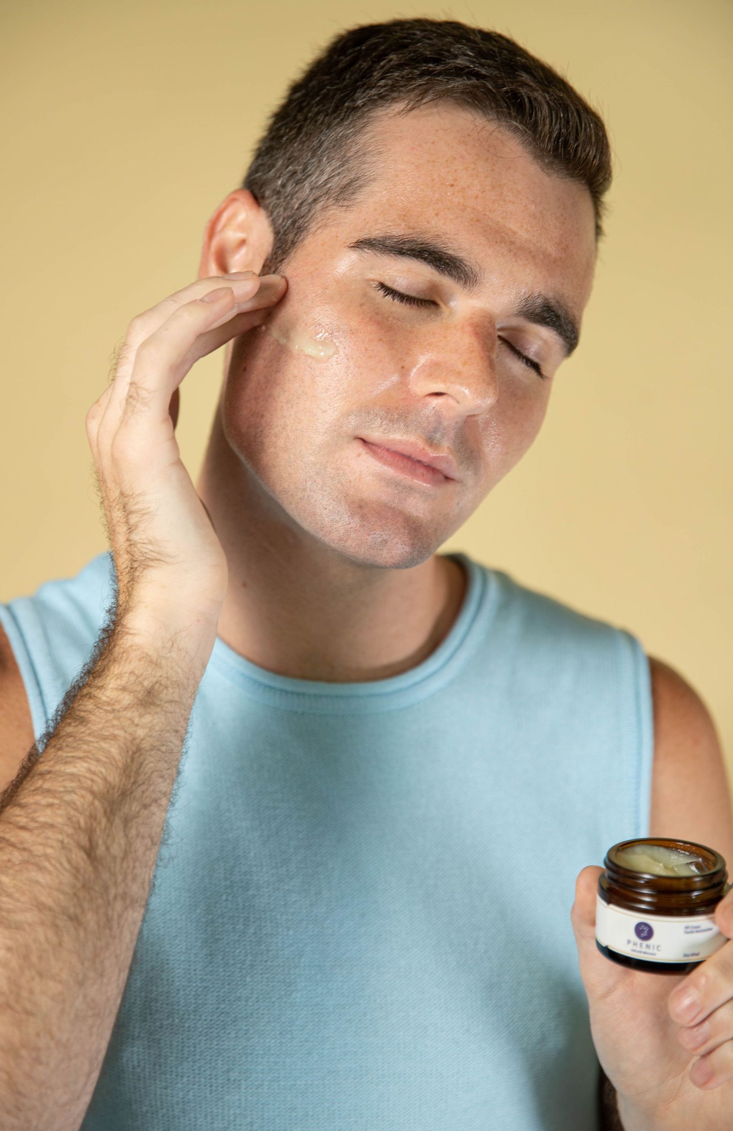 Close-up sequence showing application of skincare product on face against warm background.