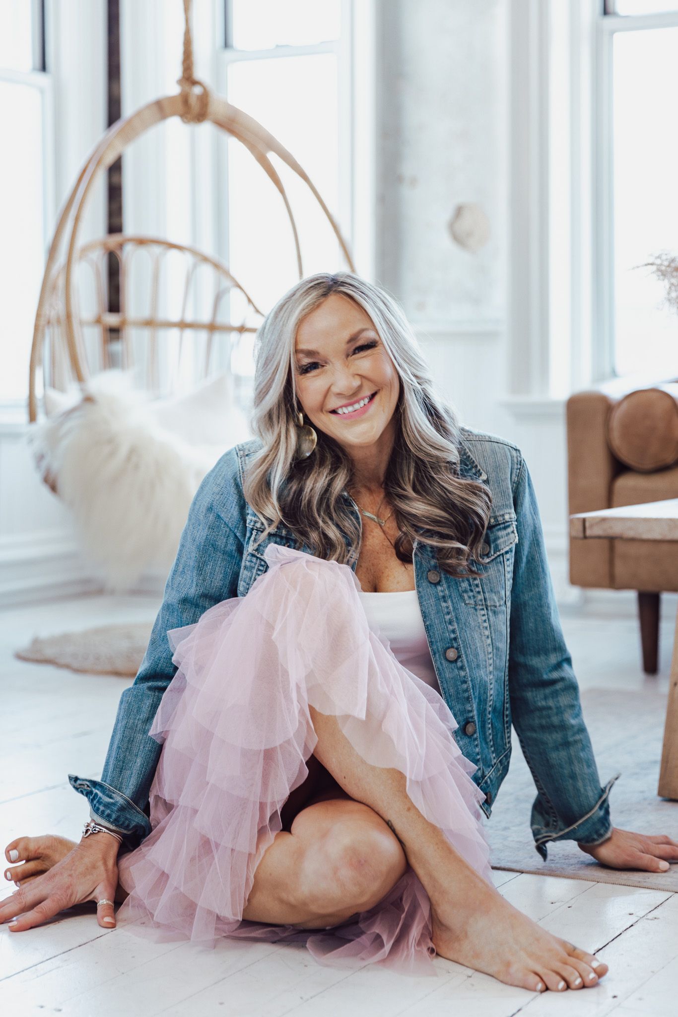 Casual lifestyle photos featuring denim jacket and pink tulle skirt in bright studio setting.
