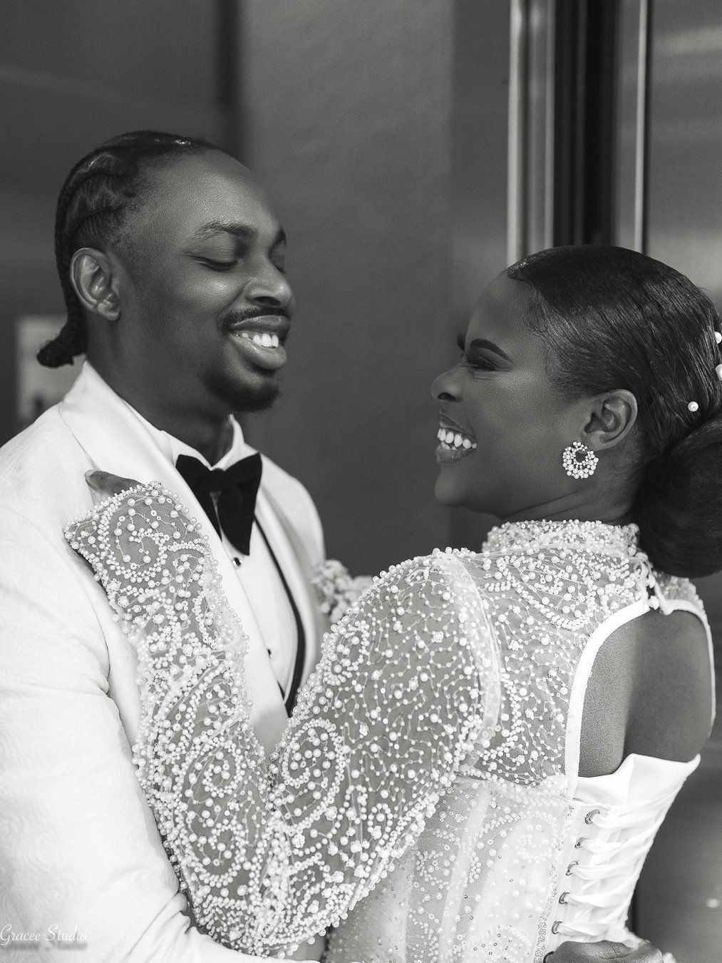 A romantic black and white photo sequence shows a couple in formal attire sharing intimate moments and laughter.