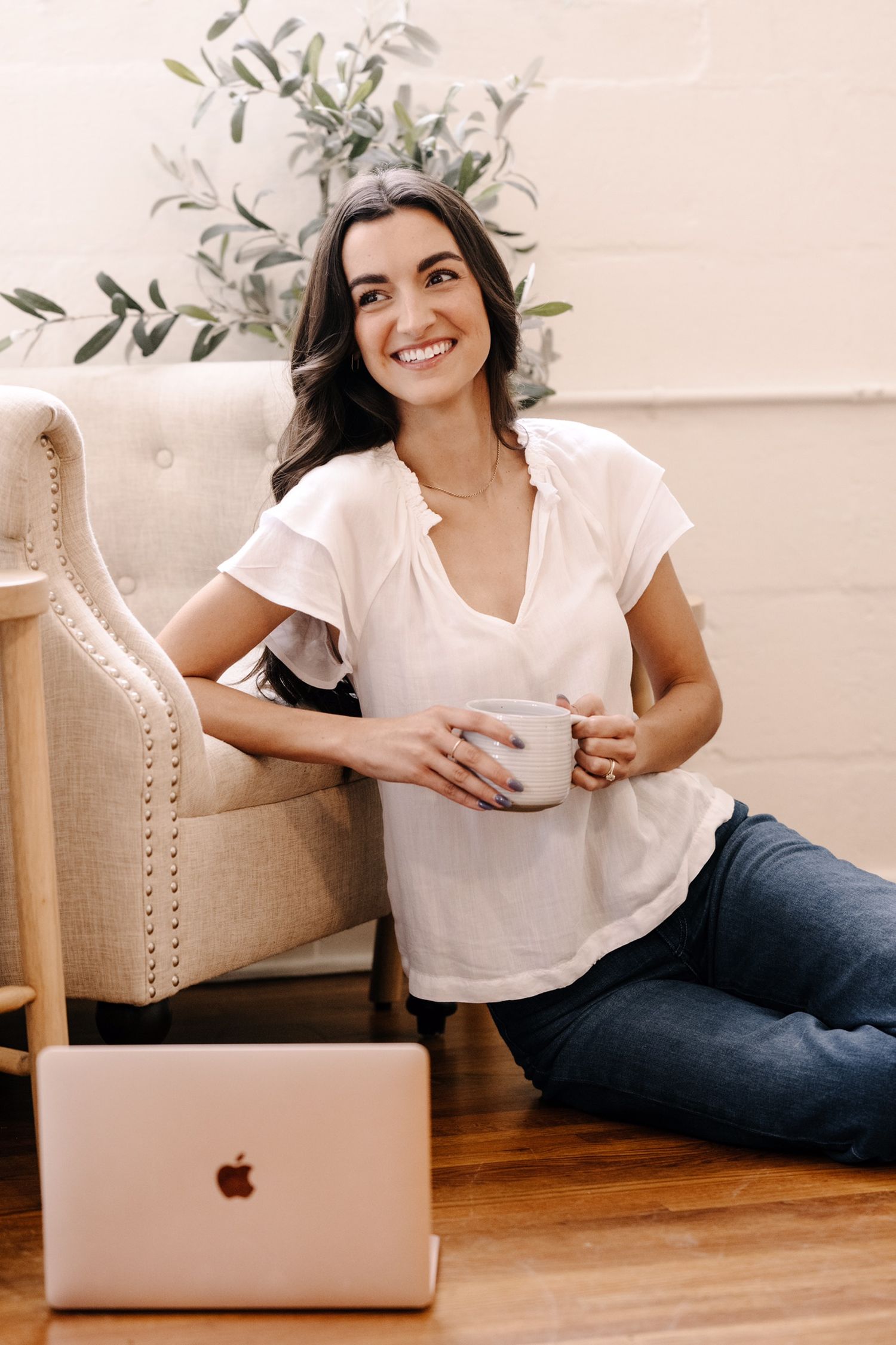 Casual lifestyle photos of person working on laptop in bright home setting.