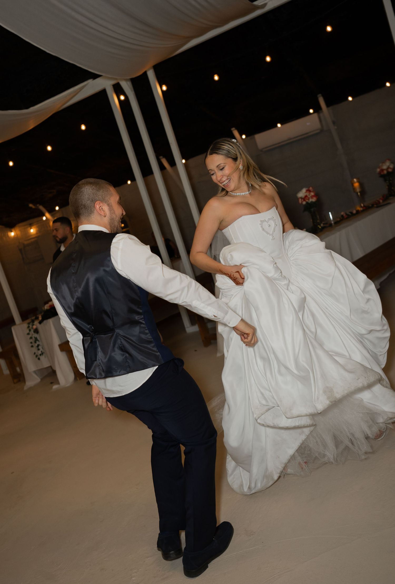 Sequence of wedding dance dips showing couple performing dramatic dance moves at reception.