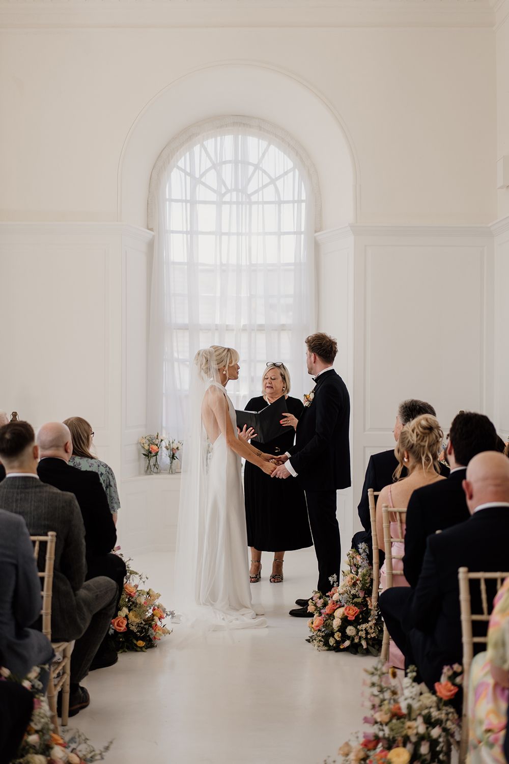 Editorial wedding moment: Bride and groom exchanging vows at The Secret Tower Newcastle.