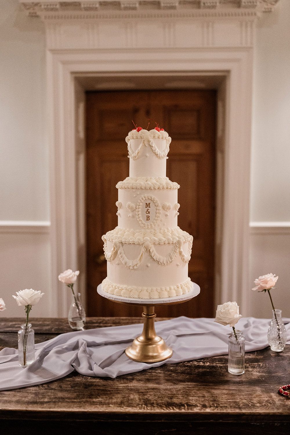 A stunning timeless luxury three-tier wedding cake at Middleton Lodge estate.