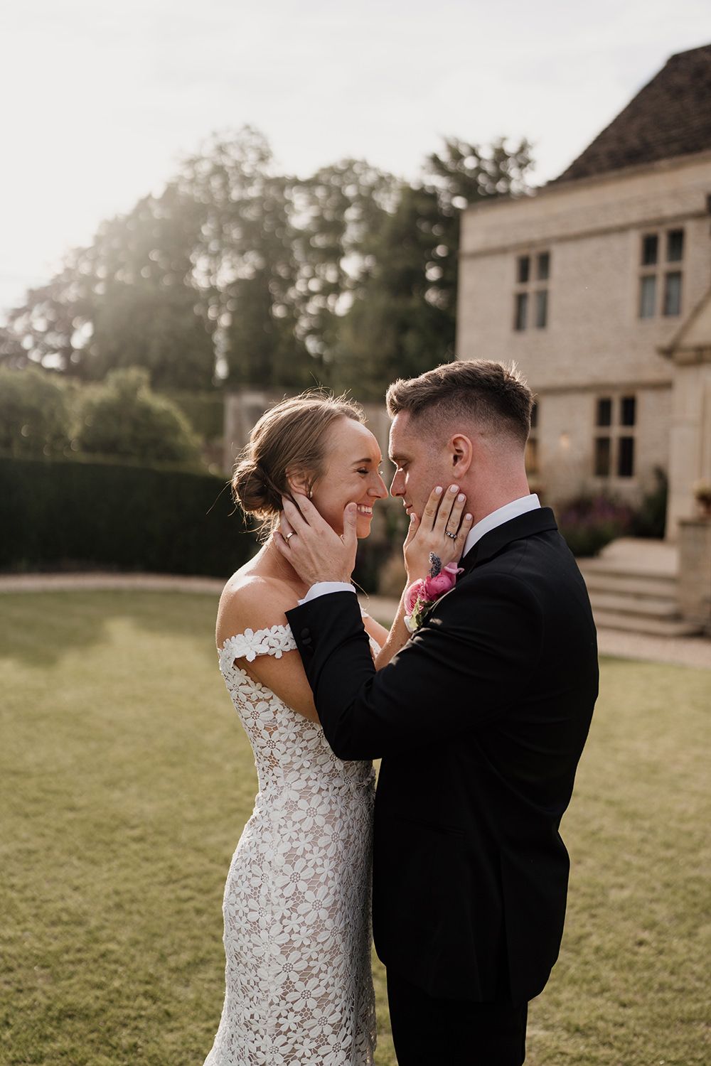 Wedding couple walking through Kin House’s walled gardens during golden hour.