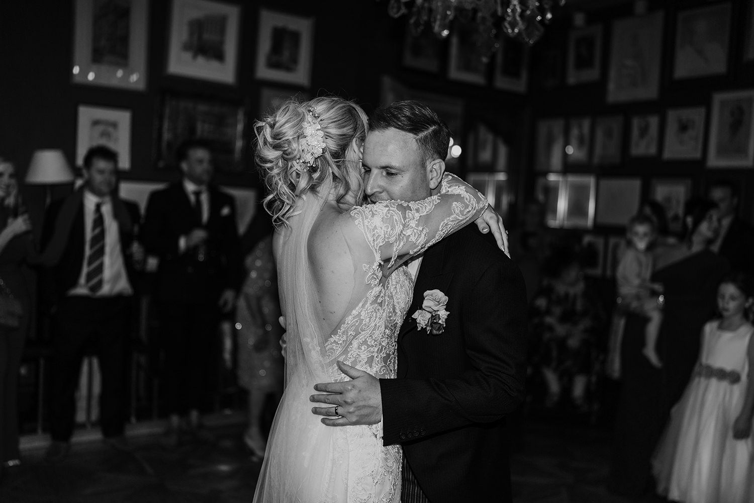 Black and white dance floor captures intimate moments at an elegant wedding reception celebration.