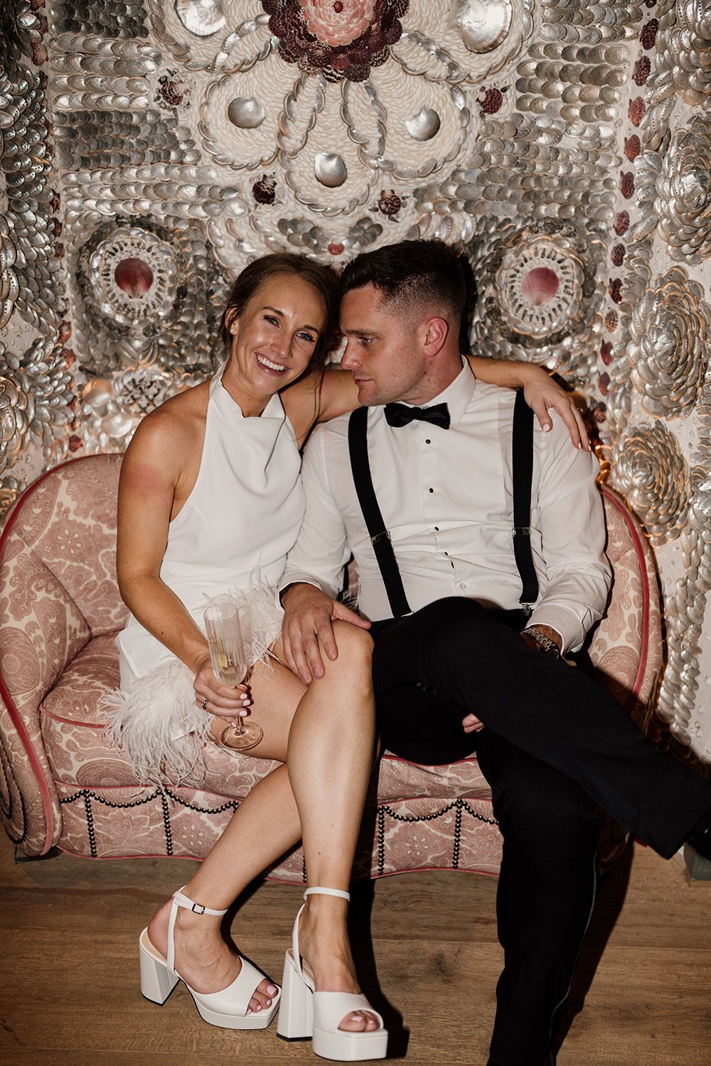 Editorial wedding portraits of bride and groom at Kin House’s iconic shell chair.